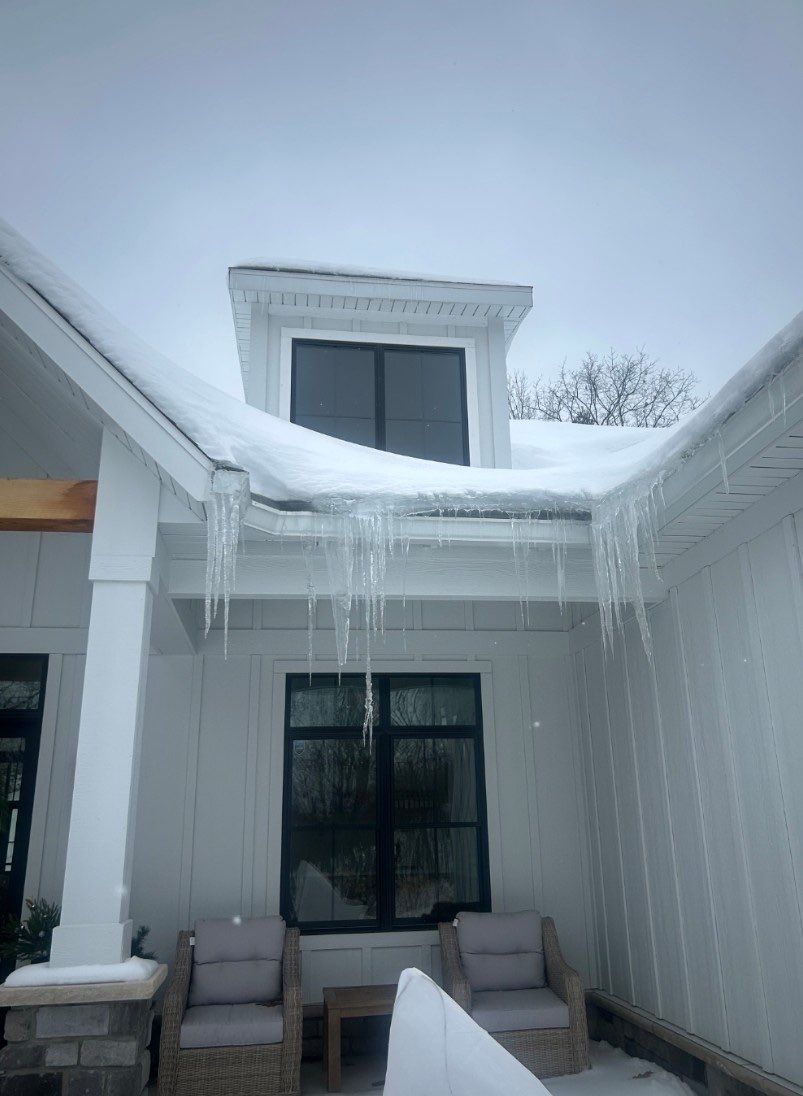 Residential Ice Dam Removal in Traverse City by Rainbow Seamless Systems
