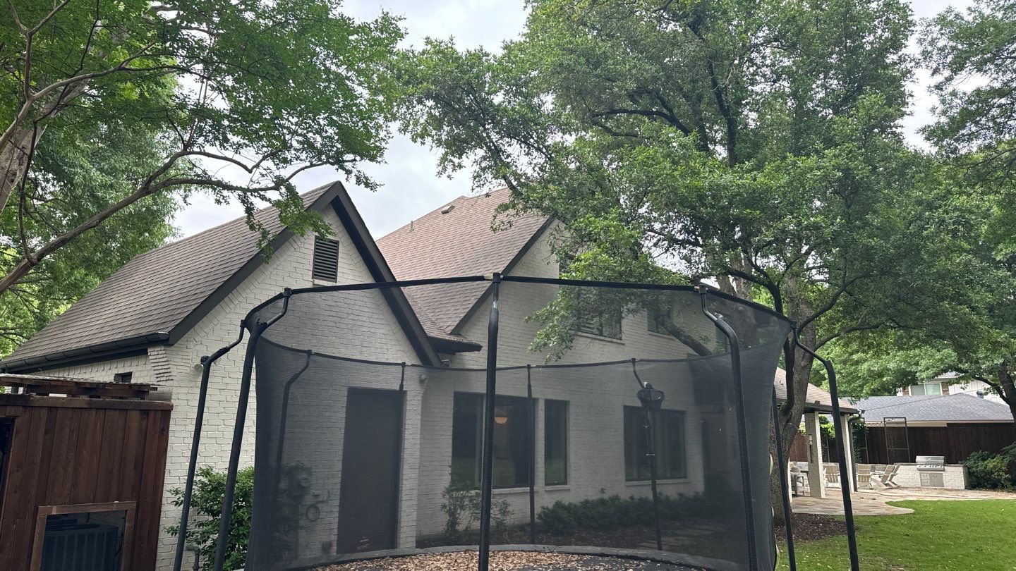 White brick with GAF Weathered Wood by Tejas Roofworks + Restoration
