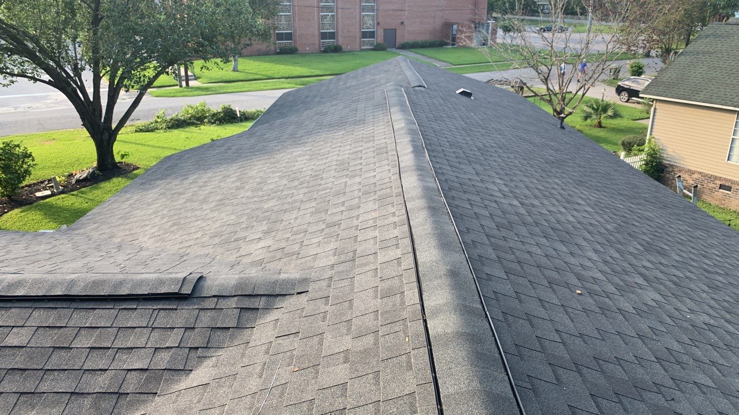 Hail Damage using Atlas Pristine Pinnacle Shingles by Artigues Roofing & Restoration Services