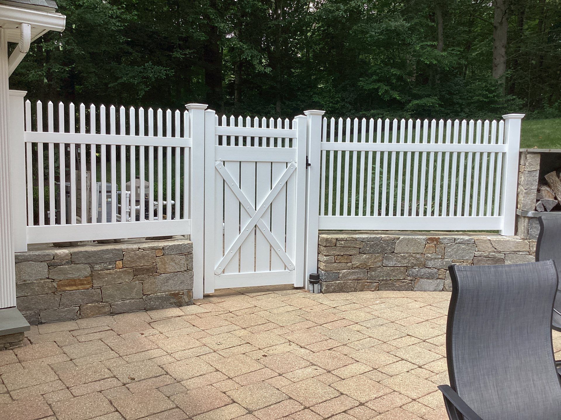 Replacement White Vinyl picket fence and matching gates by DiGiorgi Roofing and Siding Inc