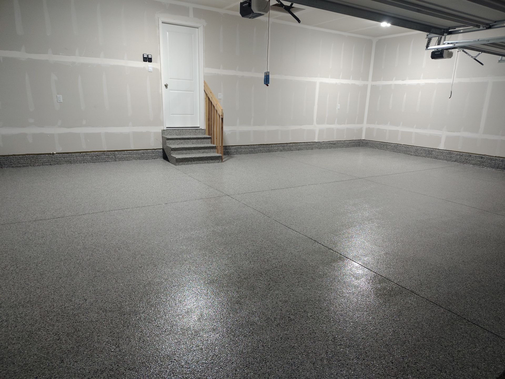 Adel, IA Garage: Complete Keystone Wrap on Floors, Stairs, and Stem Walls by Revival Concrete Coatings