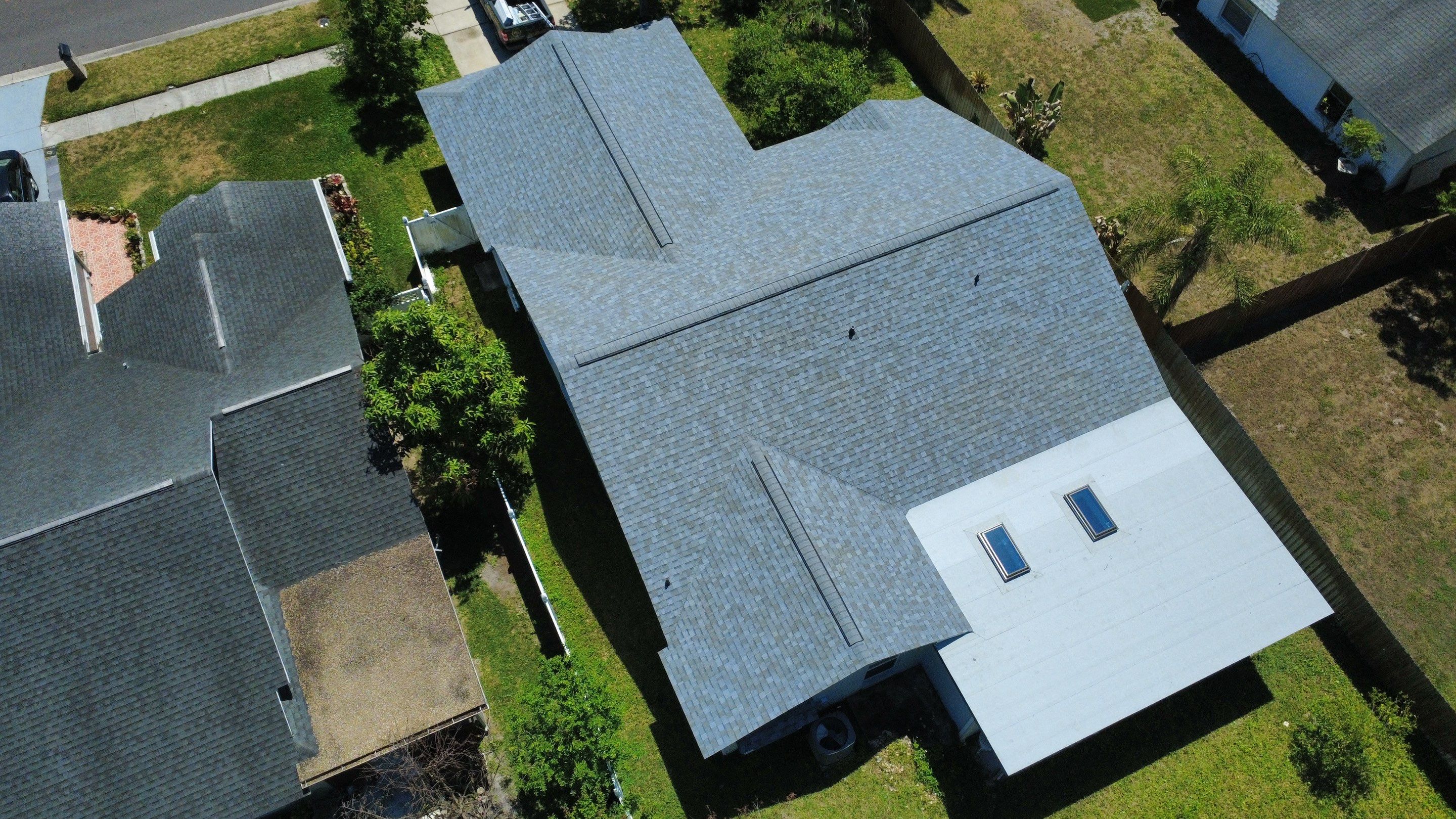Owens Corning Shingle Roof Replacement and Skylight Upgrade in Tampa by Steadfast Roofing
