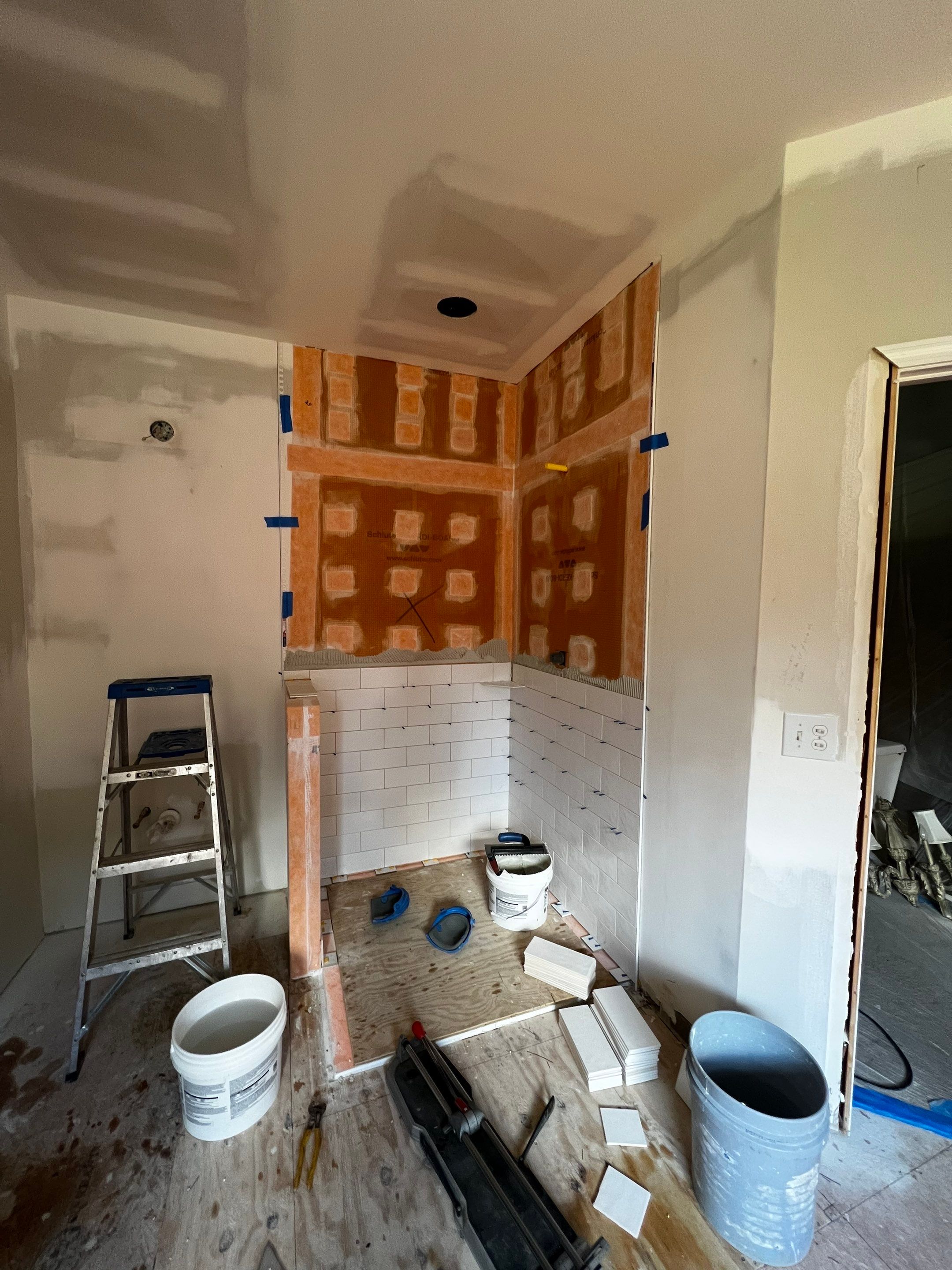 Master Bathroom Renovation with Marble Floor and Freestanding Soaking Tub by Swift Home Renovations
