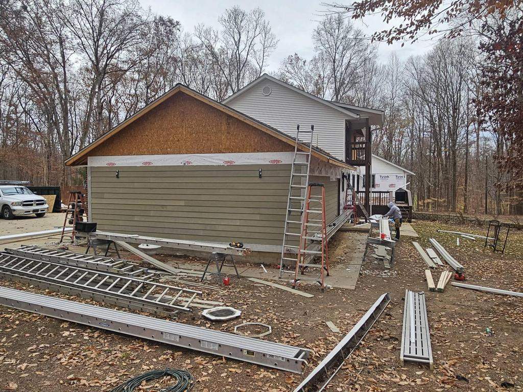 Siding Installation using Primed James Hardie & Straight Edge Shakes by Koontz Construction