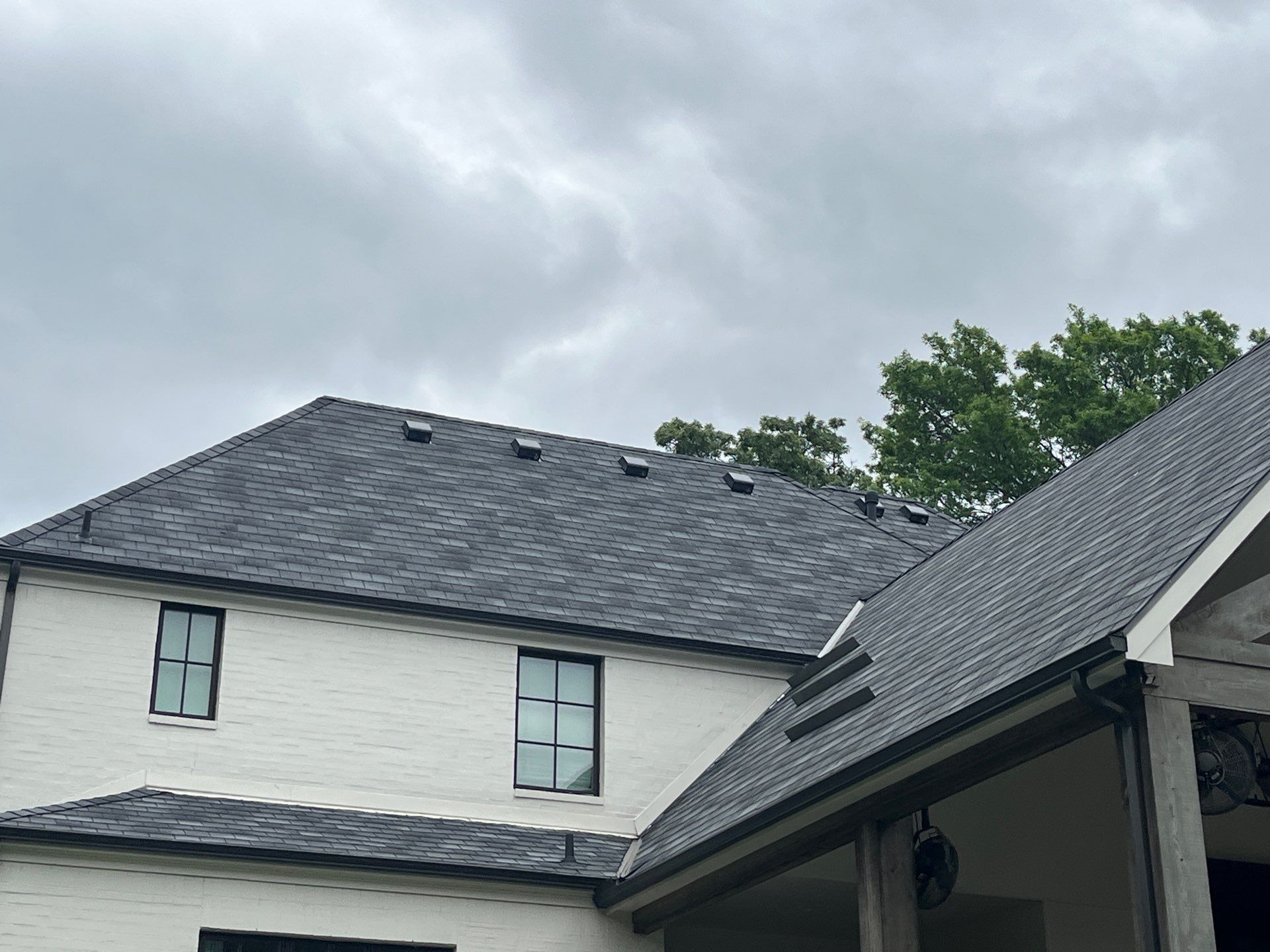 White brick with GAF Slateline English Grey by Tejas Roofworks + Restoration