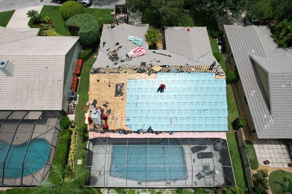 Standing Seam Metal Charcoal Grey Roof Replacement and Skylight Installation in Jupiter by Art's Roofing & Construction