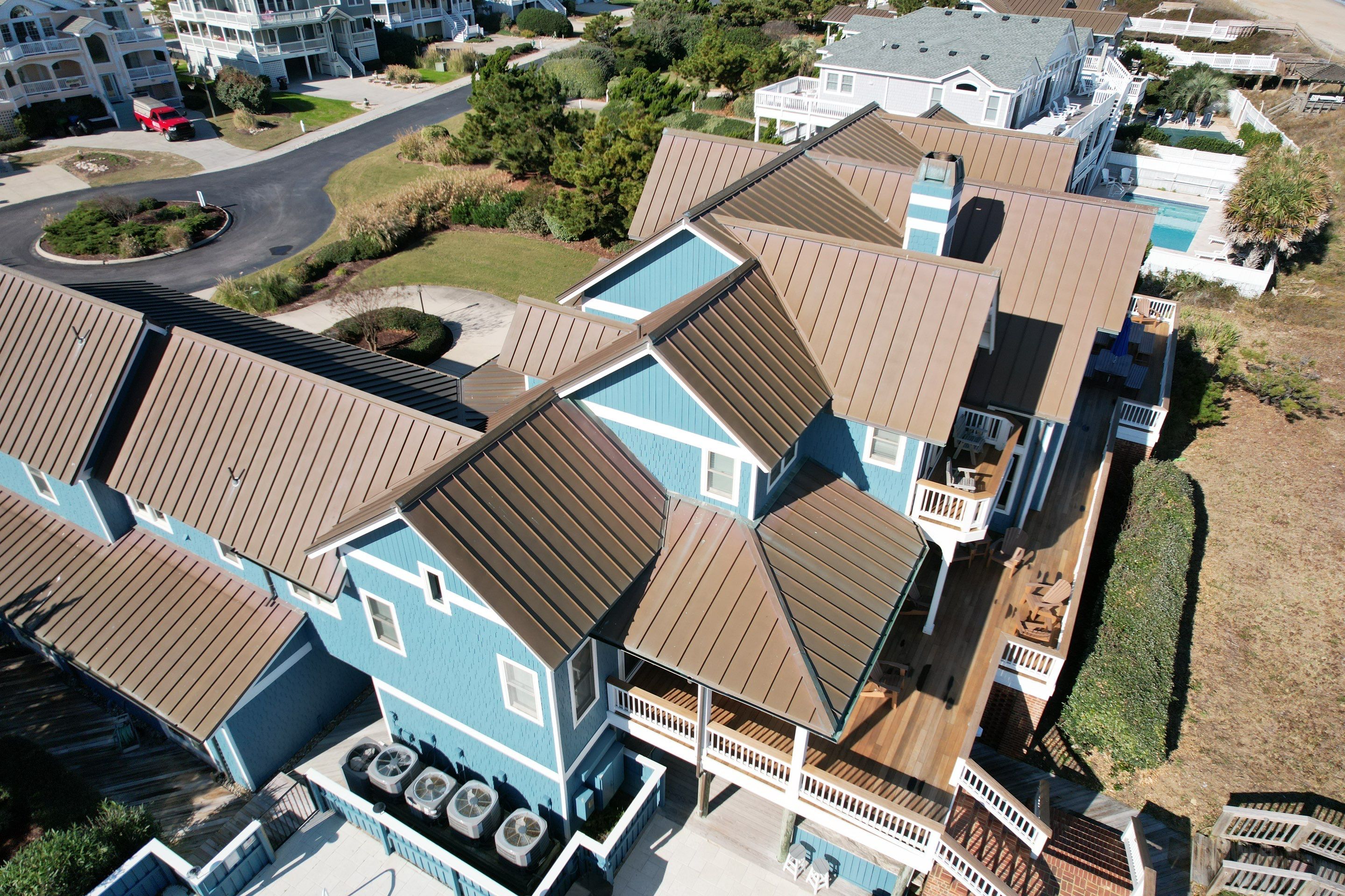 Large Metal Roof Transformation by Gallop Roofing & Remodeling, Inc.