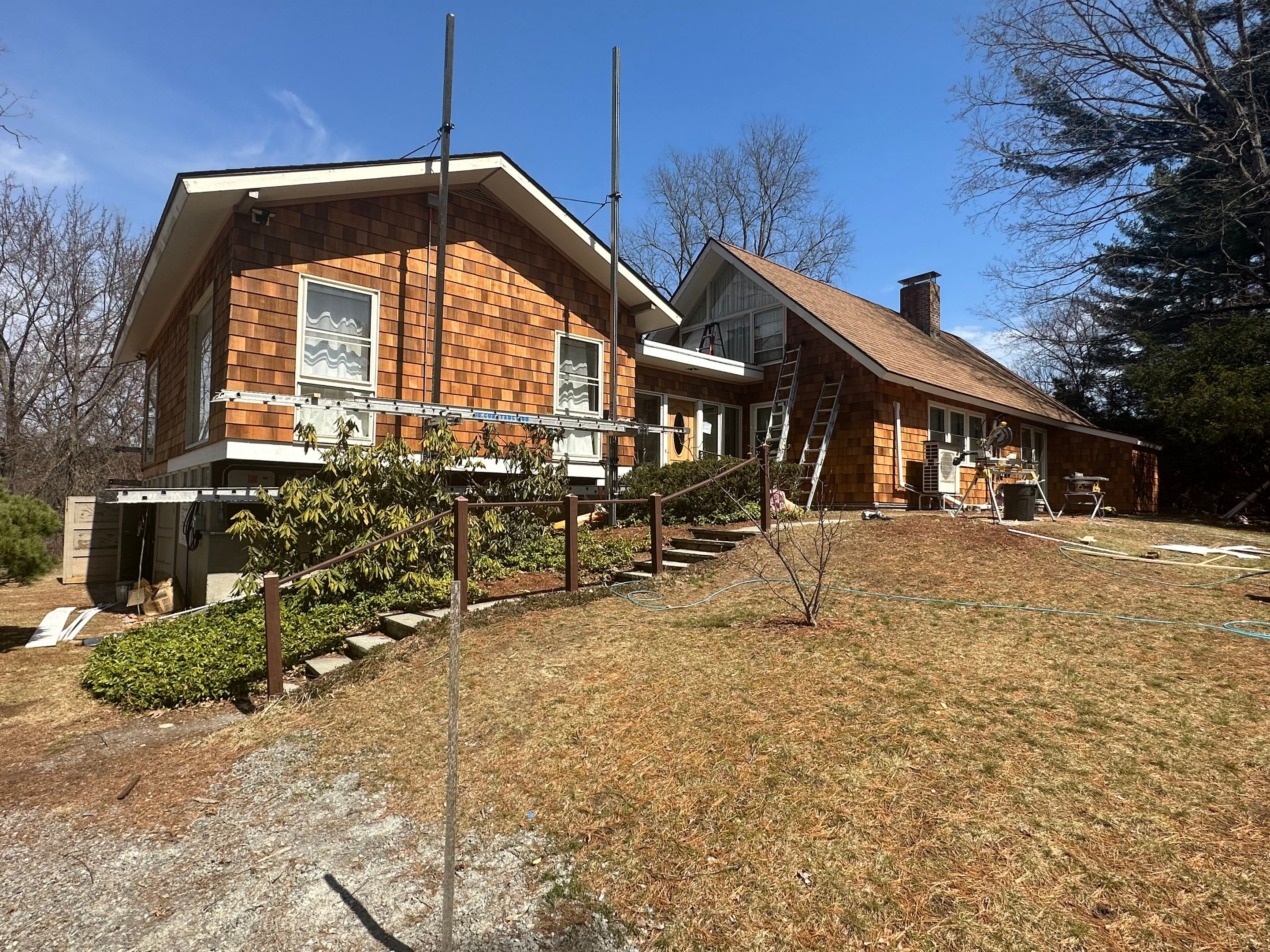 Siding Installation using Perfection Red Western Cedar Shingles  by Loyalty Exterior Solutions 
