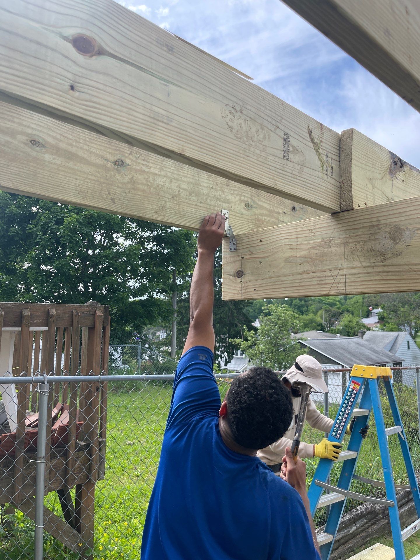 Pressure-Treated Wooden Staircase and Concrete Footing Installation in Schuylkill Haven by Herts Roofing & Construction
