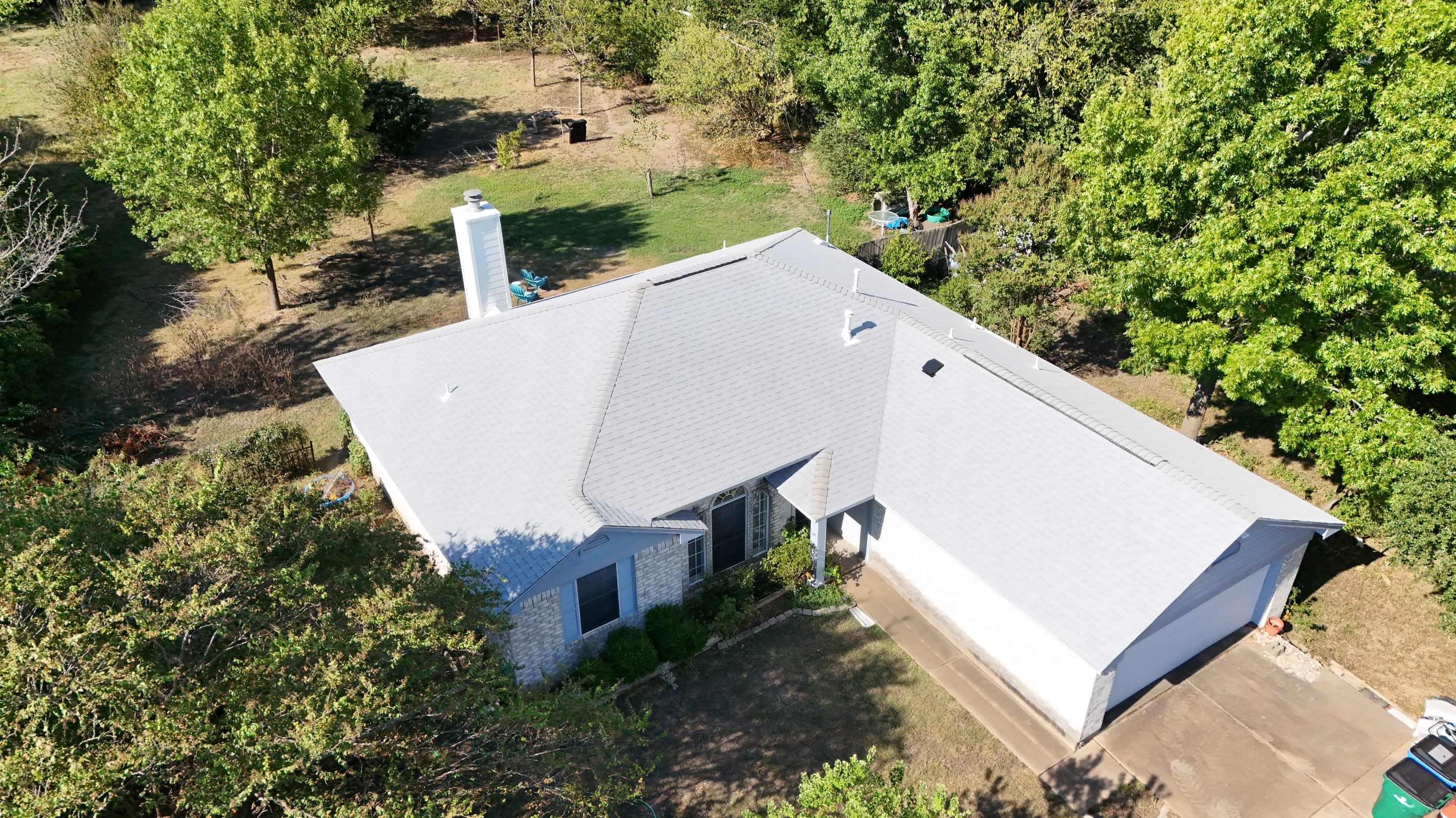 Residential Roof Replacement using Owens Corning - Duration - Shasta White by Action Exteriors Austin
