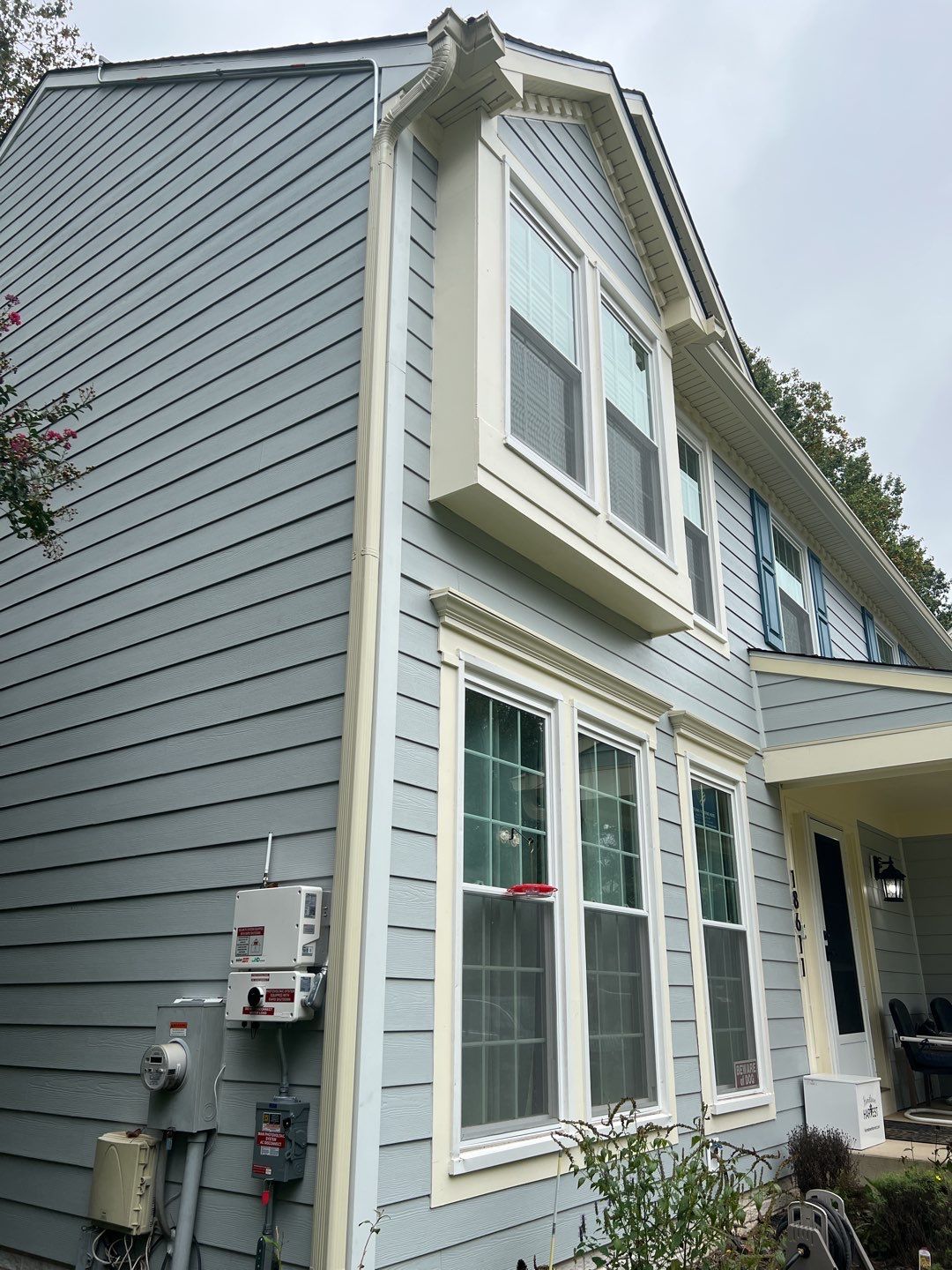 Exterior Home Makeover using GAF Timberline HDZ, GAF Decotech, and James Hardie Siding by American Home Contractors