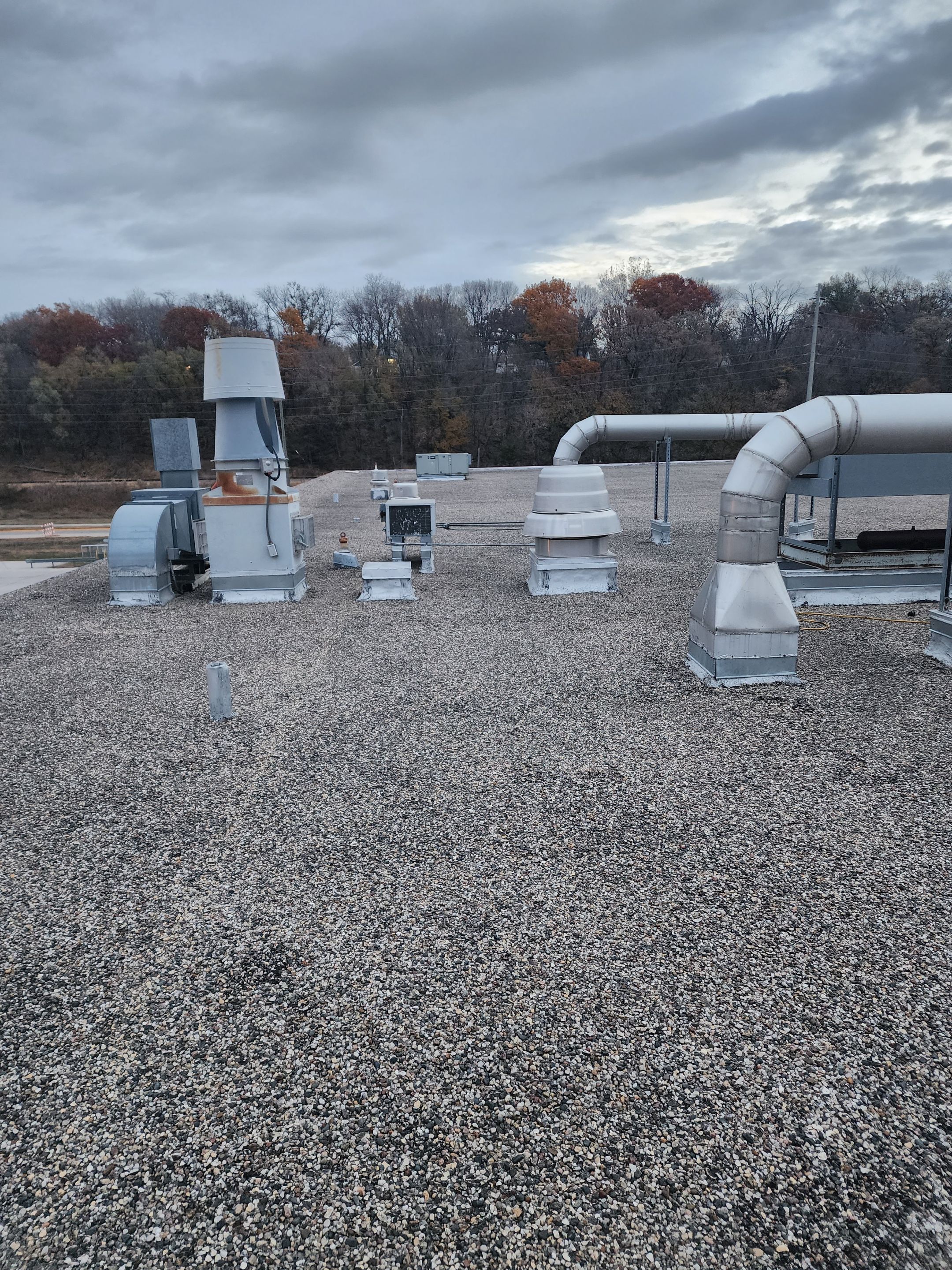 AML Riverside  by Grell Roofing, LLC