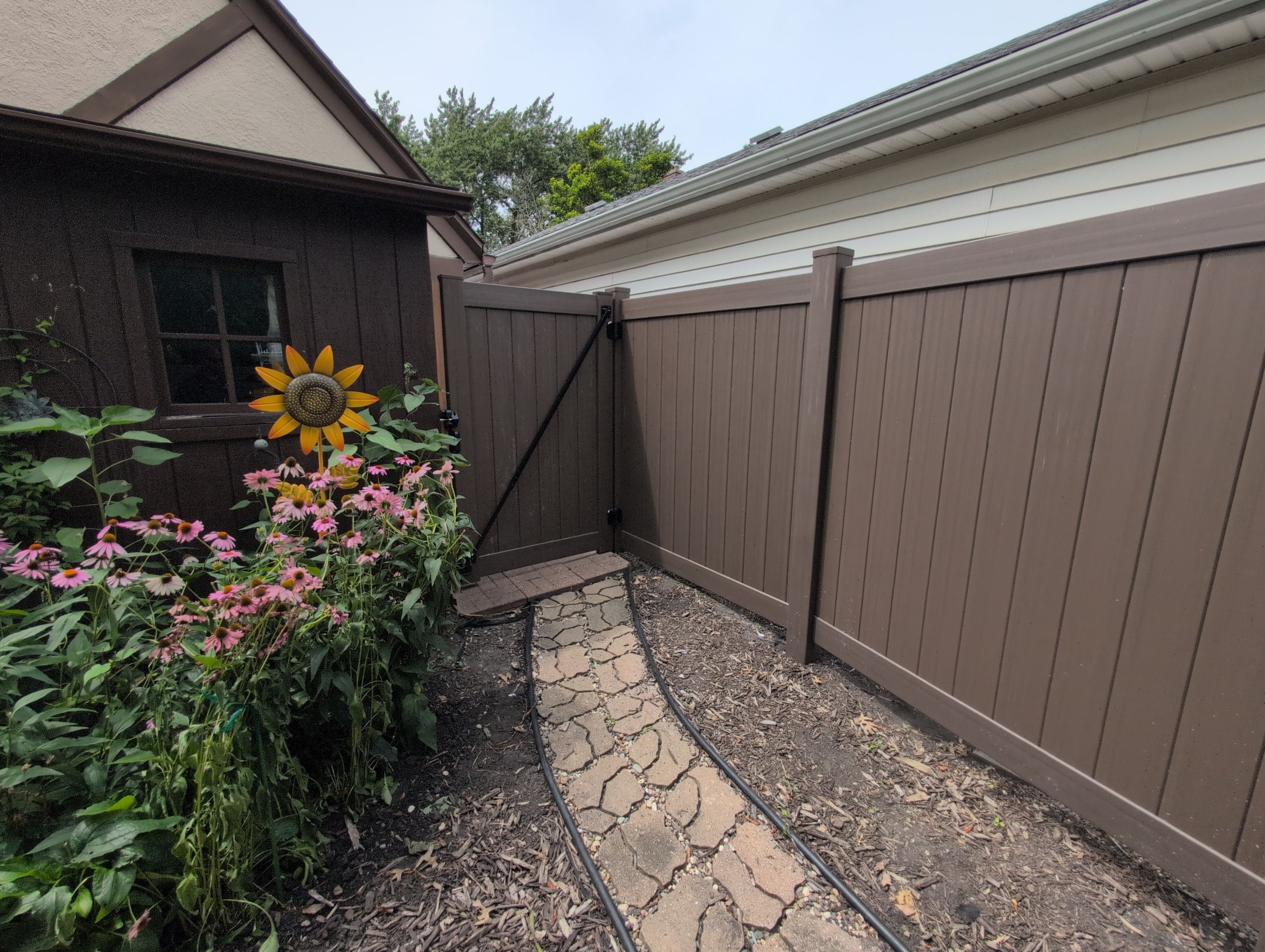 Walnut Vinyl Privacy Fence Installation in Waterloo by Perfect Picket Fence and Stain