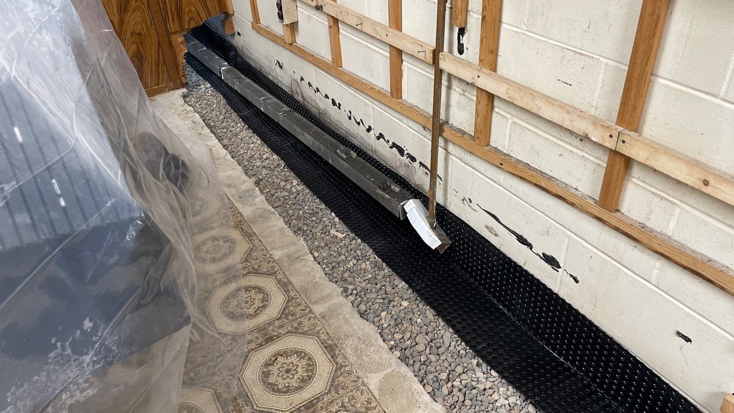 Drain Tile, Sump Pump & Buried Discharge in Columbia Heights by Waterproofing Northeast