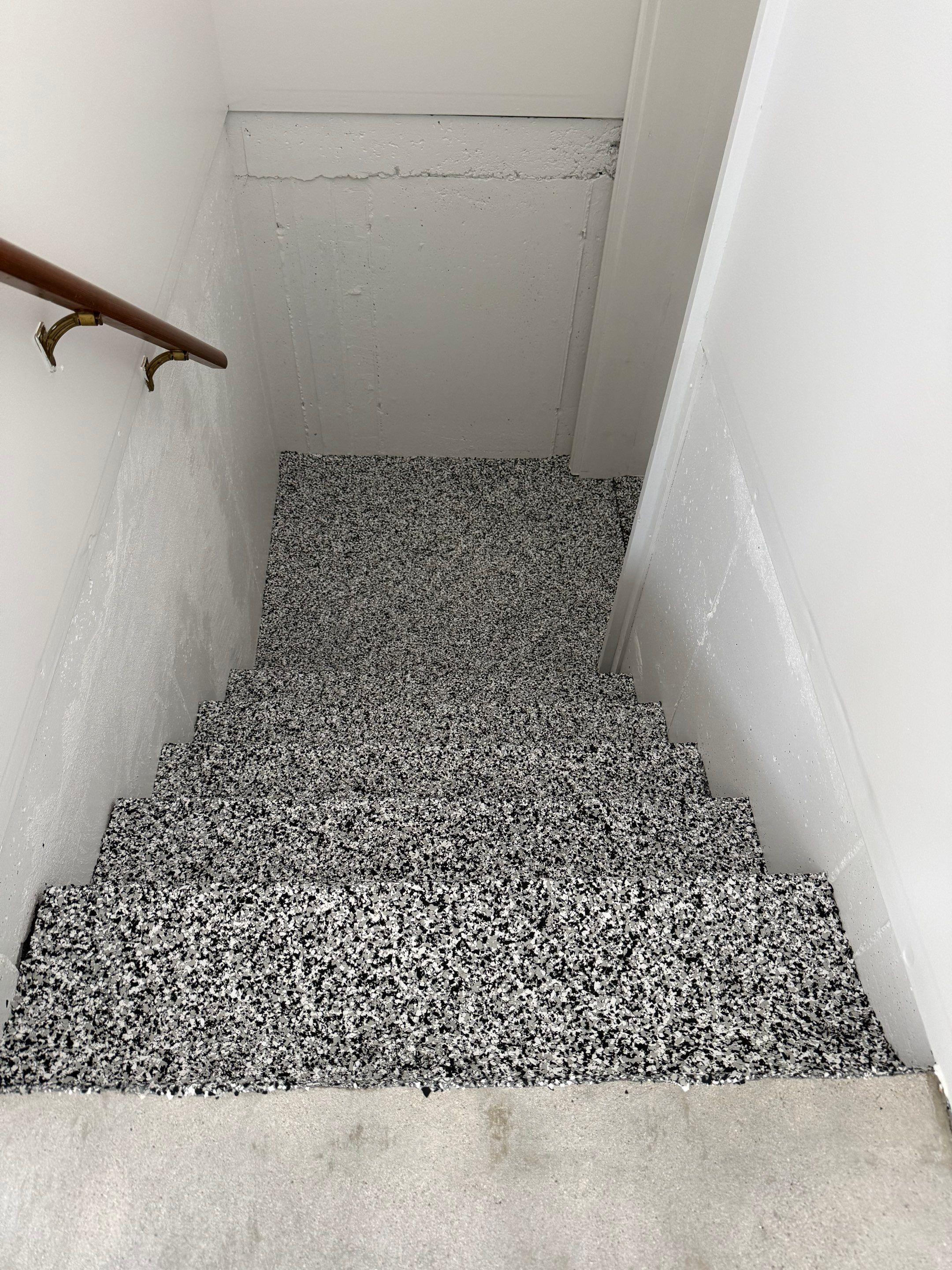 Full Garage Floor and Basement Stair Epoxy Coating in Sioux Falls by Select Painting, Coatings & Garage Cabinets