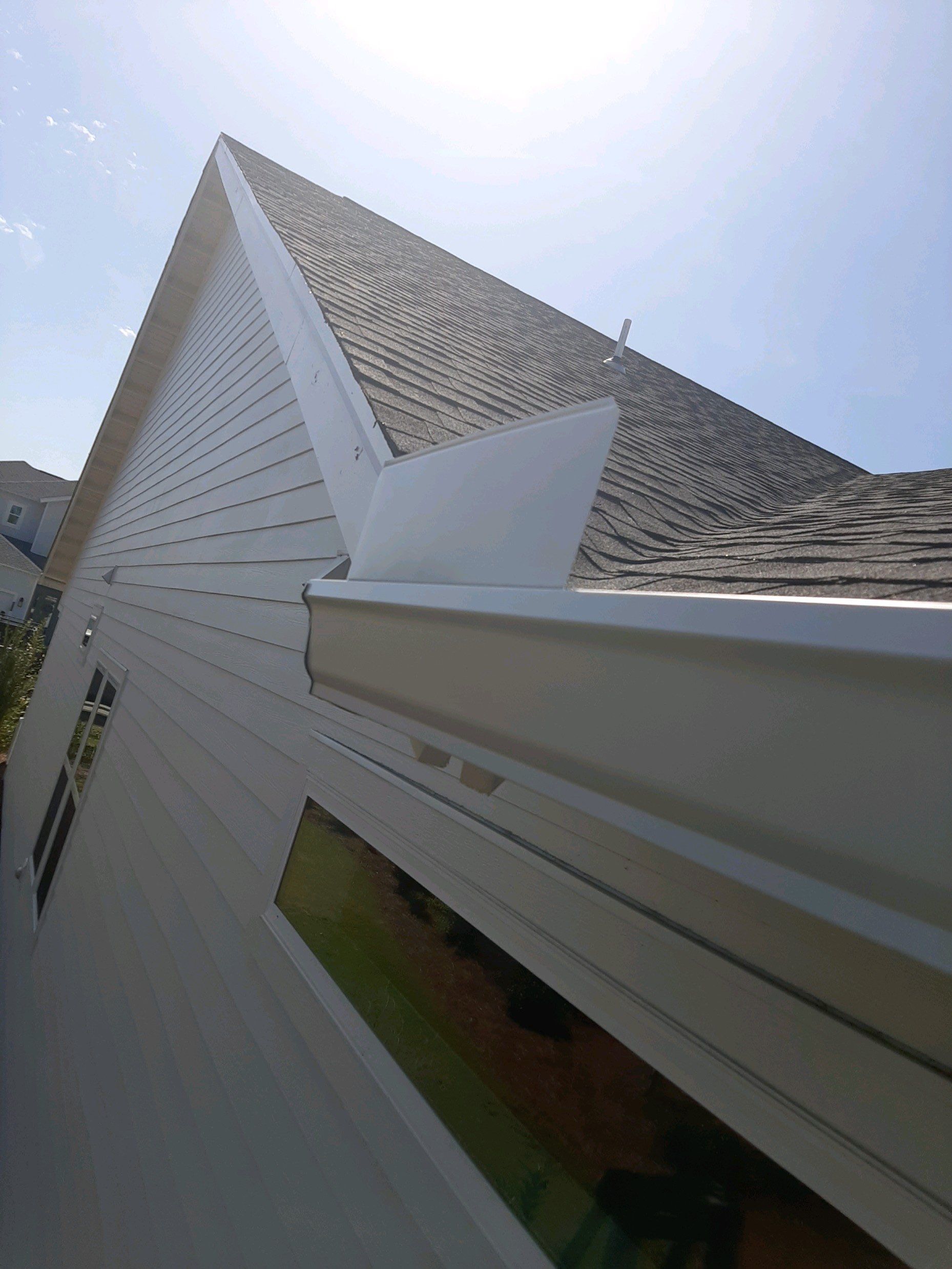 Gutter Installation Using White K-Style Aluminum Seamless Gutters by Gutter Professors