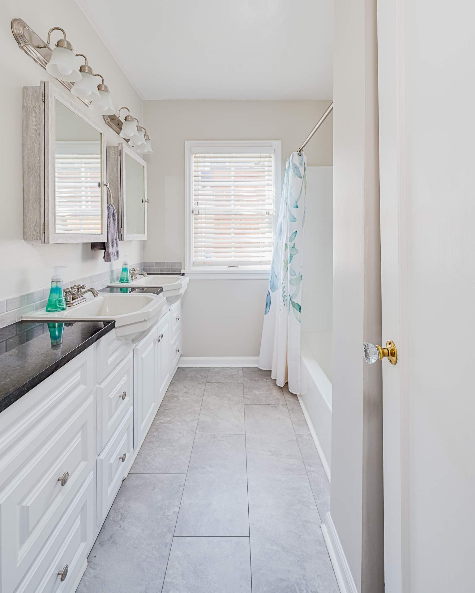 Modern Bathroom Remodeling With Dual Vanity and Subway Tile by American Made Construction