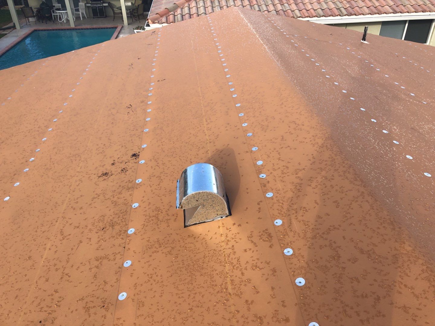 Residential Roofing Installation using 1" Nail strip metal roof by BLUES BROTHERS CONSTRUCTION CORP