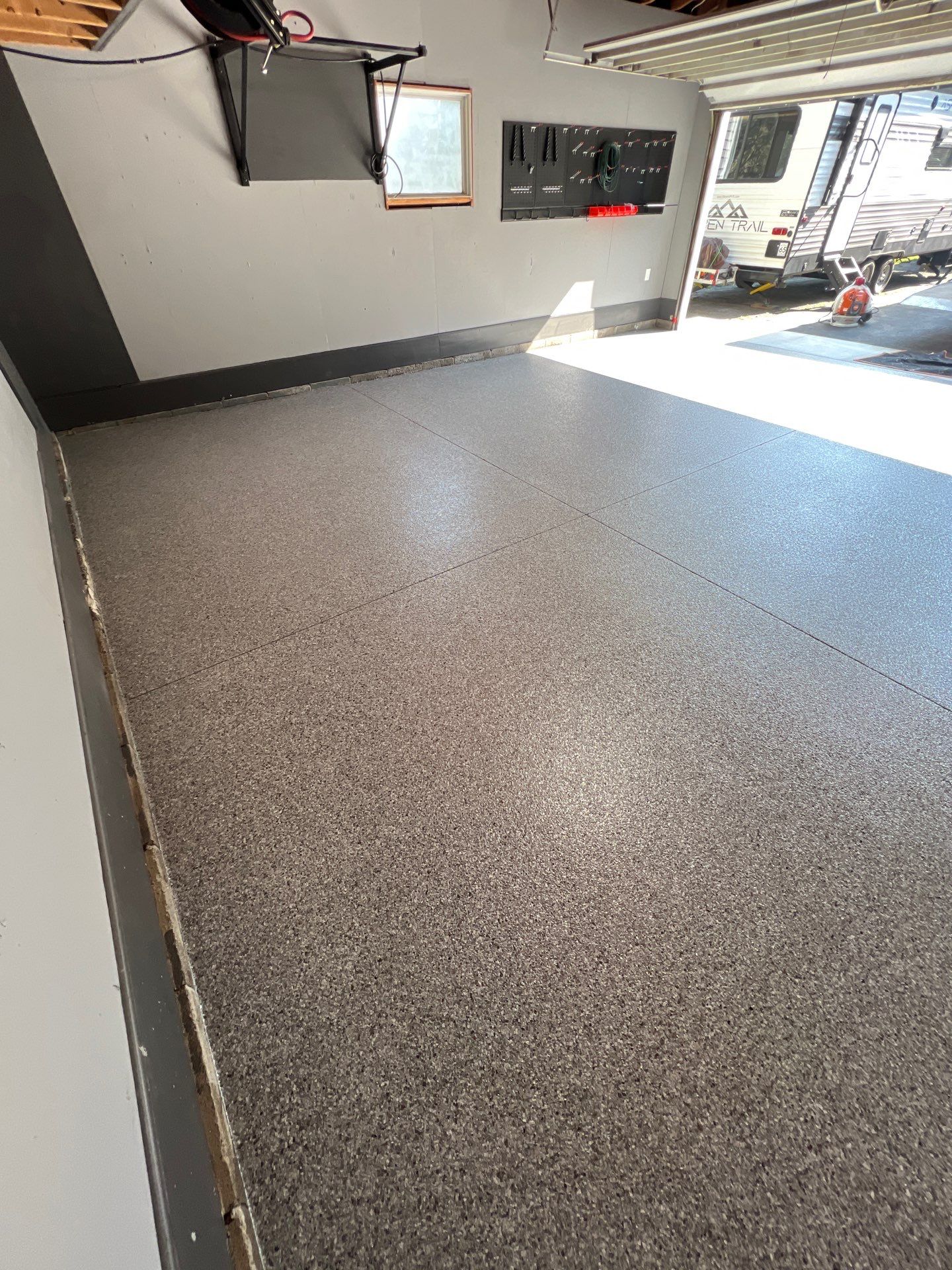 Concrete garage floor replacement and epoxy coating installed by NG Masonry & Construction LLC