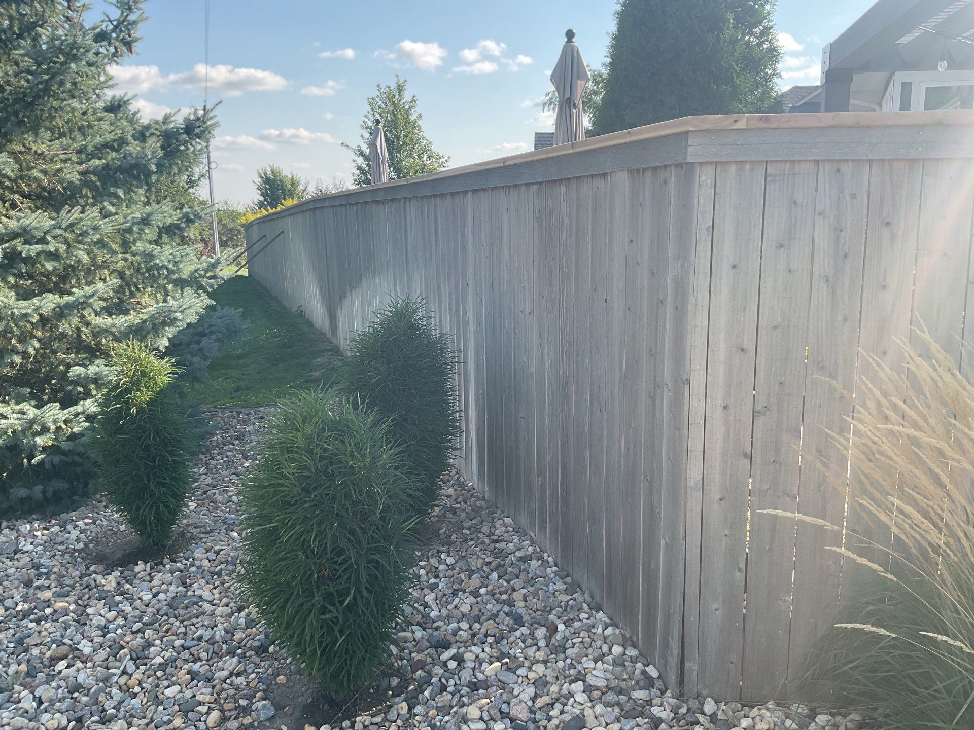 Custom Privacy Fence and Paver Patio Installation in Sioux Falls by Select Painting, Coatings & Garage Cabinets