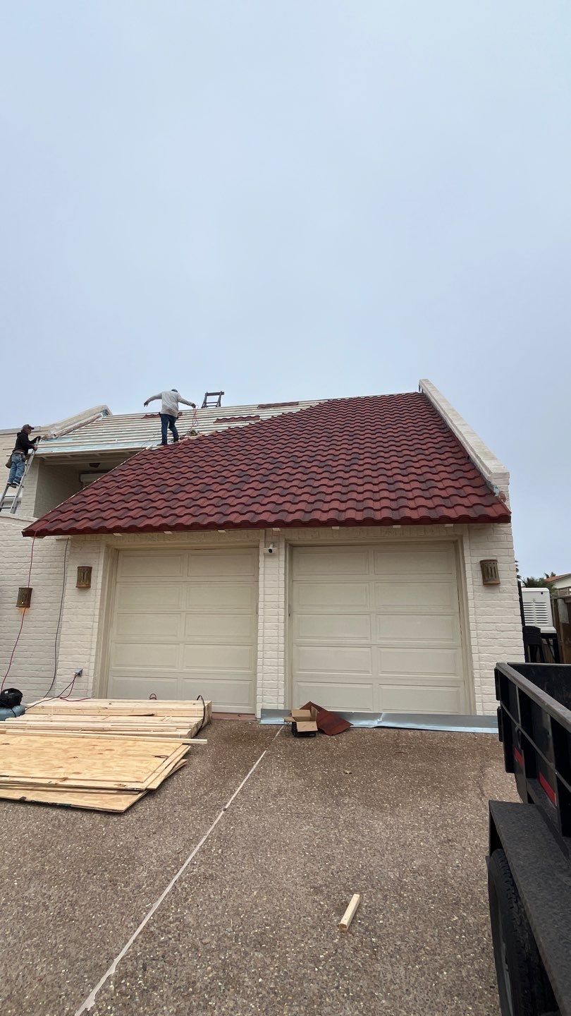 Off with the Tile and on with the TILCOR stone coated metal.  by Bayfront Roofing and Construction