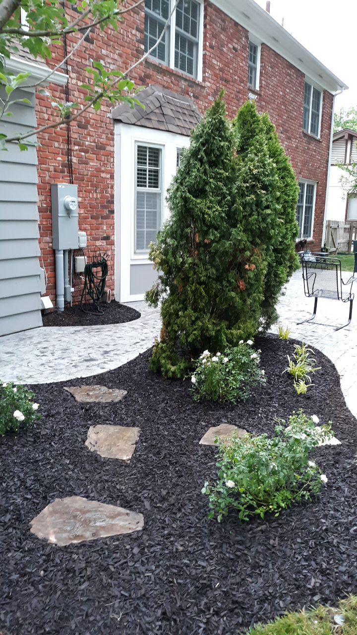 Back Yard Stamped Patio by LAND ESCAPES LLC