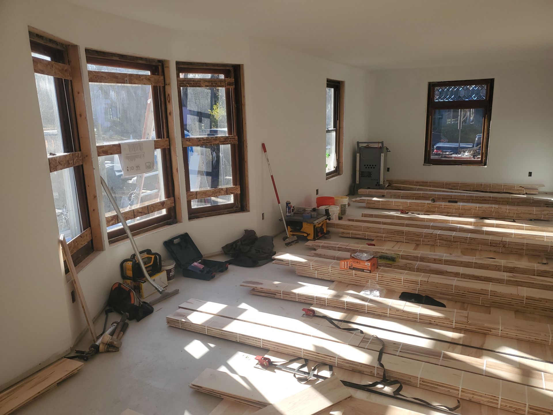 Full glue down Installation over radiant heat 7" Maple character grade by Ann Arbor Hardwoods 