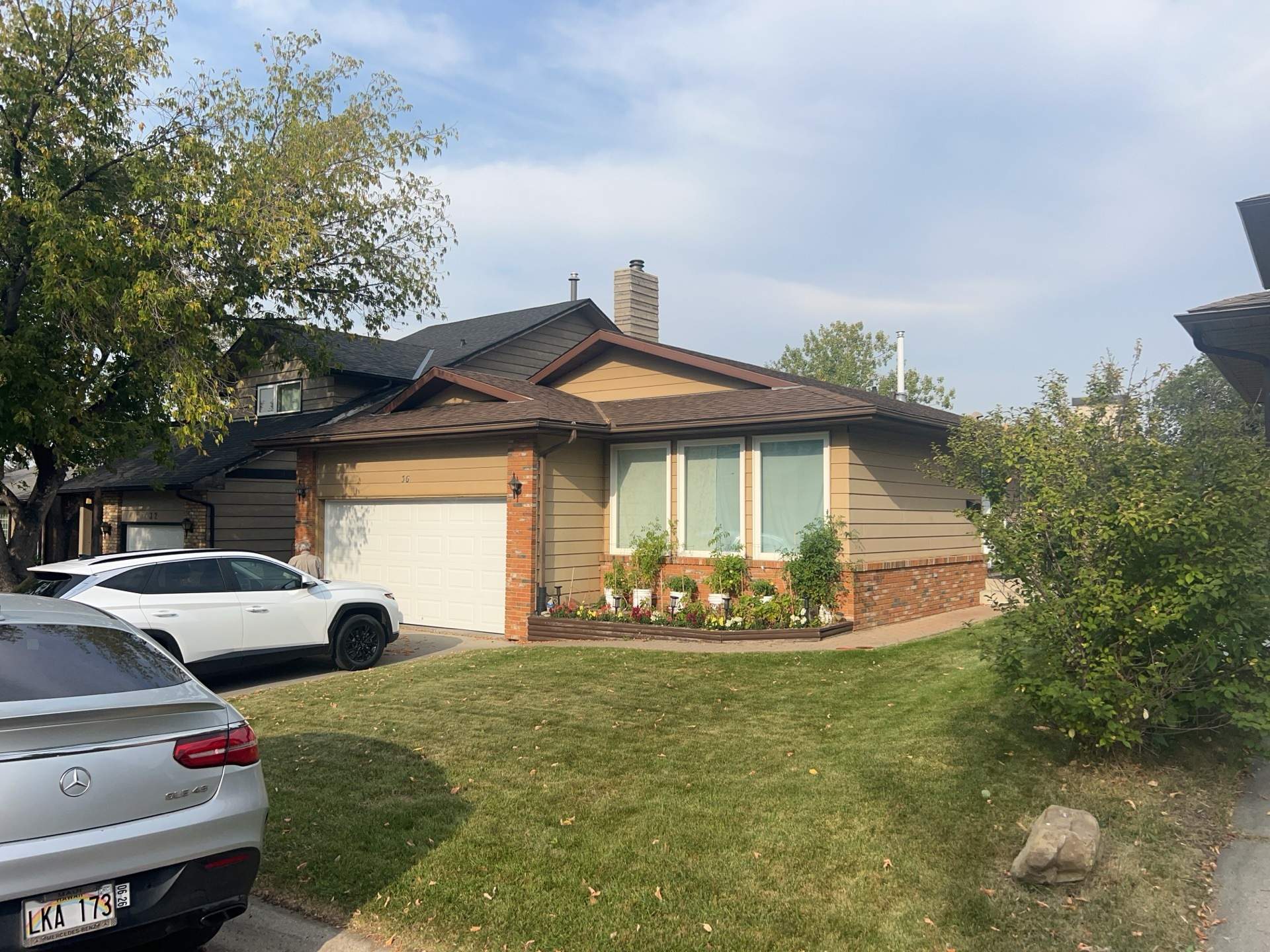 Calgary Chimney Chase Reconstruction and Exterior Siding Replacement by Smart Home Building Systems Ltd.