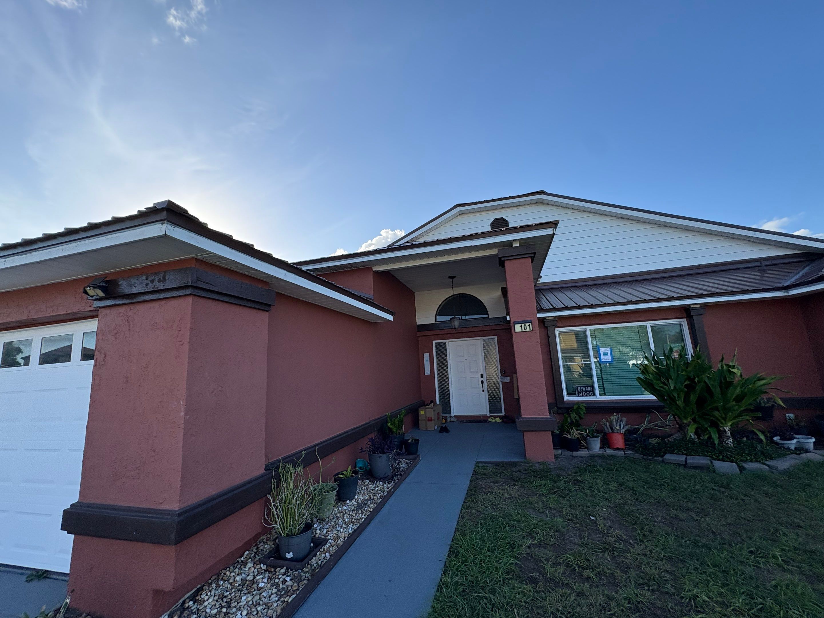 Residential Metal Roofing Installation and Gutter Replacement in Kissimmee by Pinnacle Roofing Group