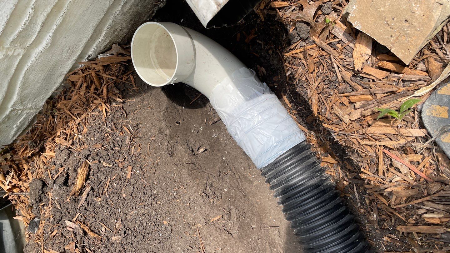 Drain Tile, Window Wells & Buried Discharge in Minneapolis by Waterproofing Northeast