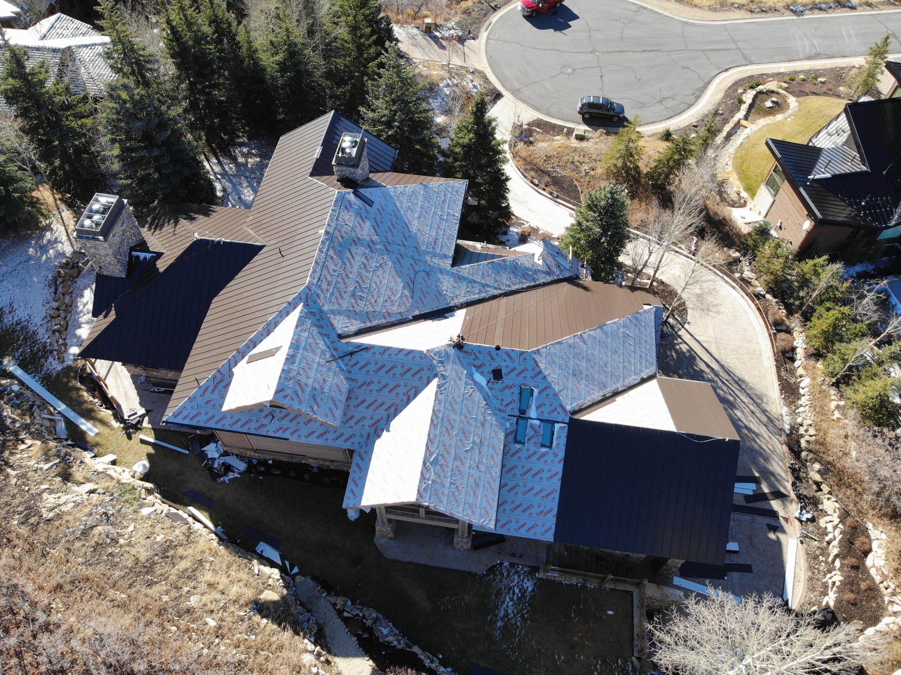 Standing Seam Metal Roof Replacement After Snow Damage by ASAP Roofing & Restoration