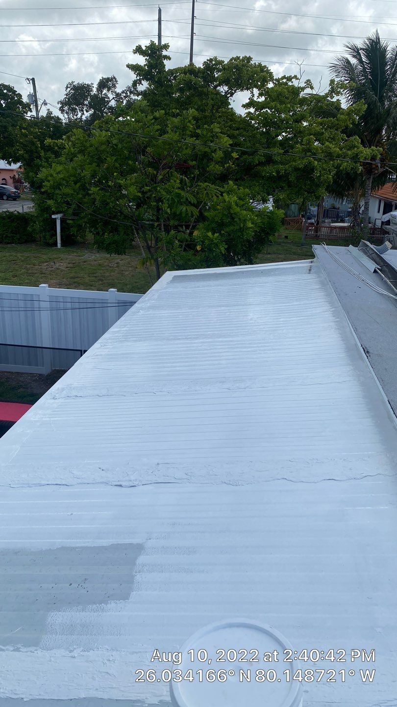 Standing Seam Metal & Flat Re-Roof using 1.5" Nail Strip 24ga Black Matte Kynar Coated Standing Seam Metal Panels by Morton Roofing, Inc.