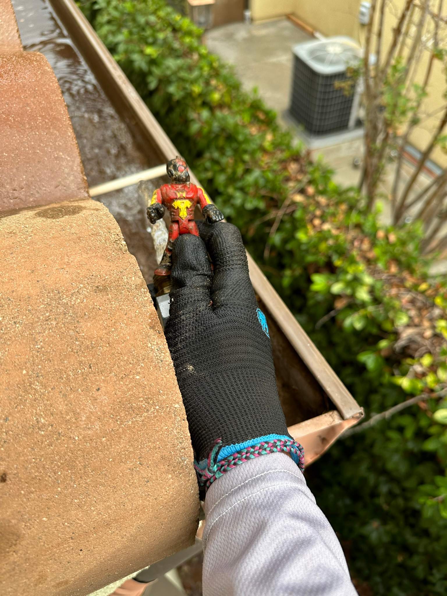 Clogged gutters at this Irvine home in Woodbury by Property Cleaning Experts, LLC