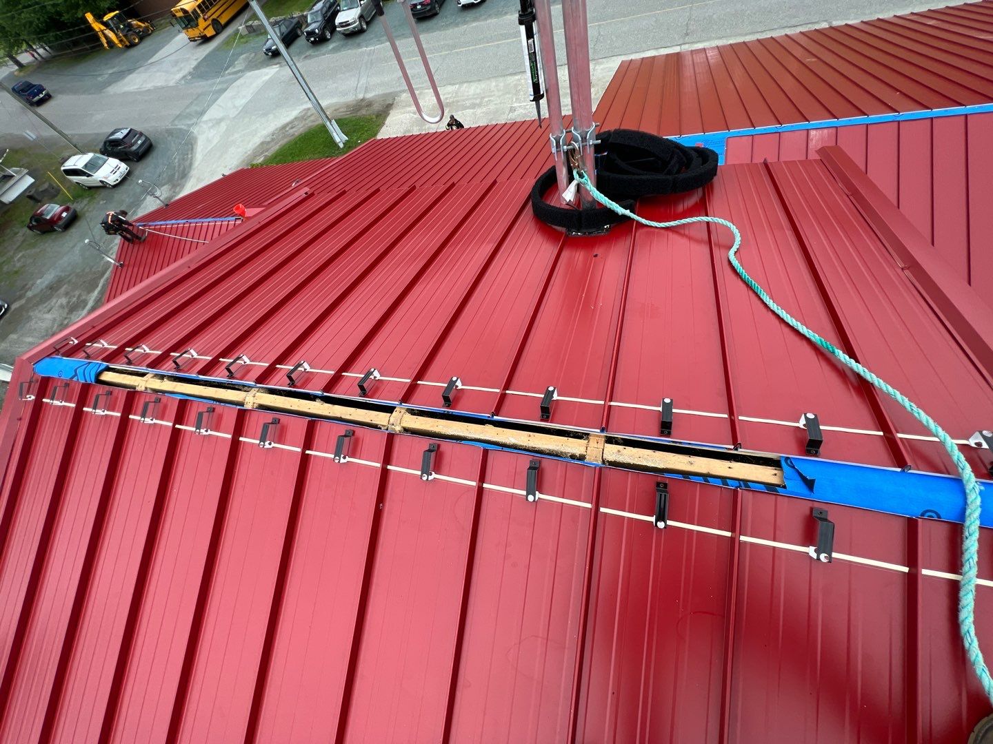 Commercial Roofing Installation using 12" Prolok metal  by Top Notch Roofing Inc