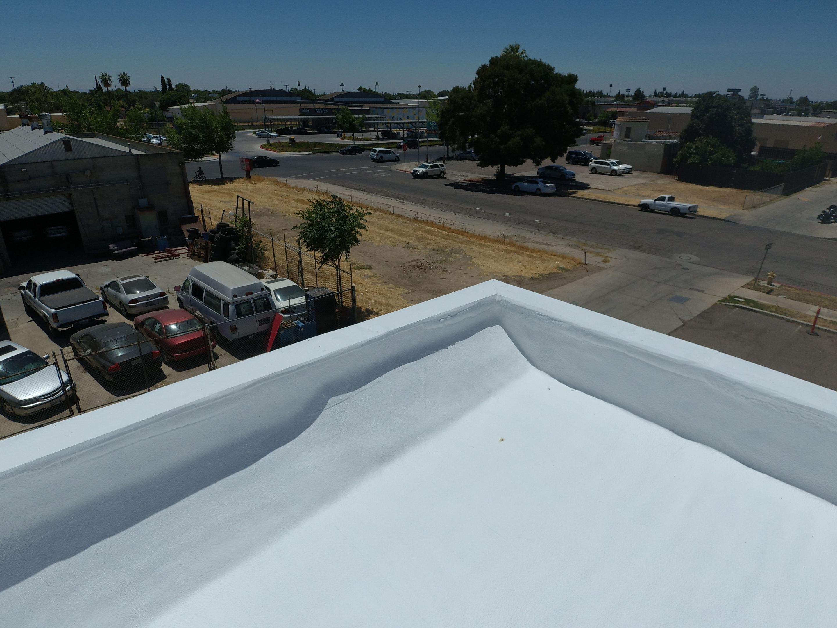 Spray foam and coatings using Conklin Benchmark/PUMA XL coatings and spray foam by Straight Edge Roofing Inc