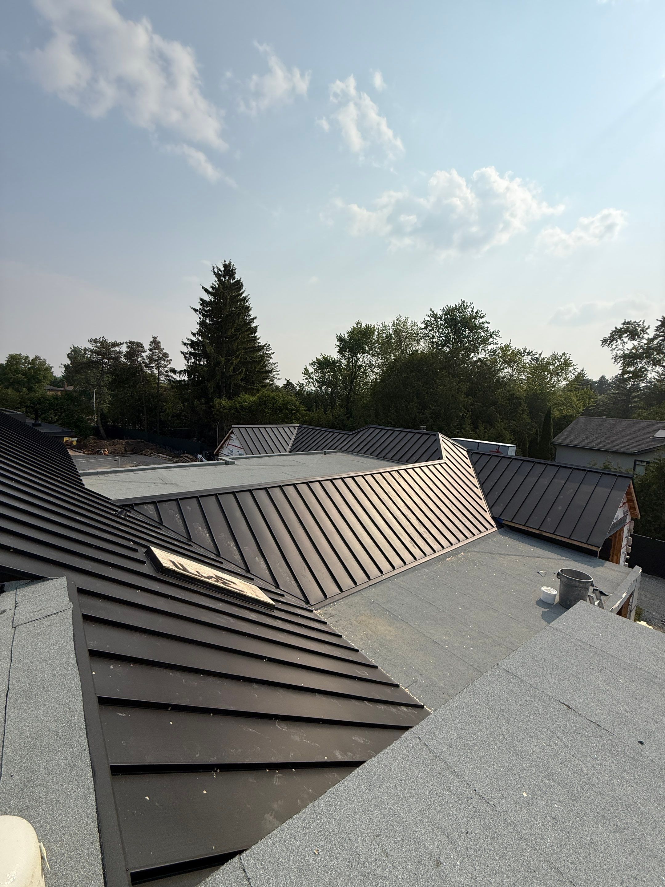 Custom Home Jet Black 24 GA Standing Seam Roof  by Jay Carter Roofing & Sheet Metal