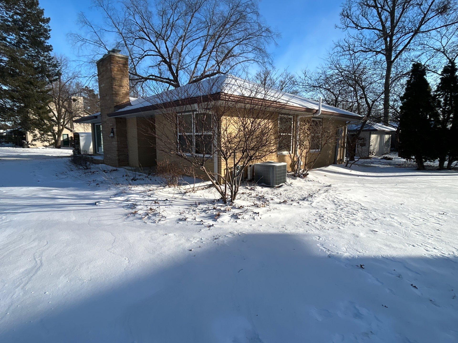Black-Frame Pella Lifestyle Upgrade on a Partial Brick Home by United Windows and Siding LLC