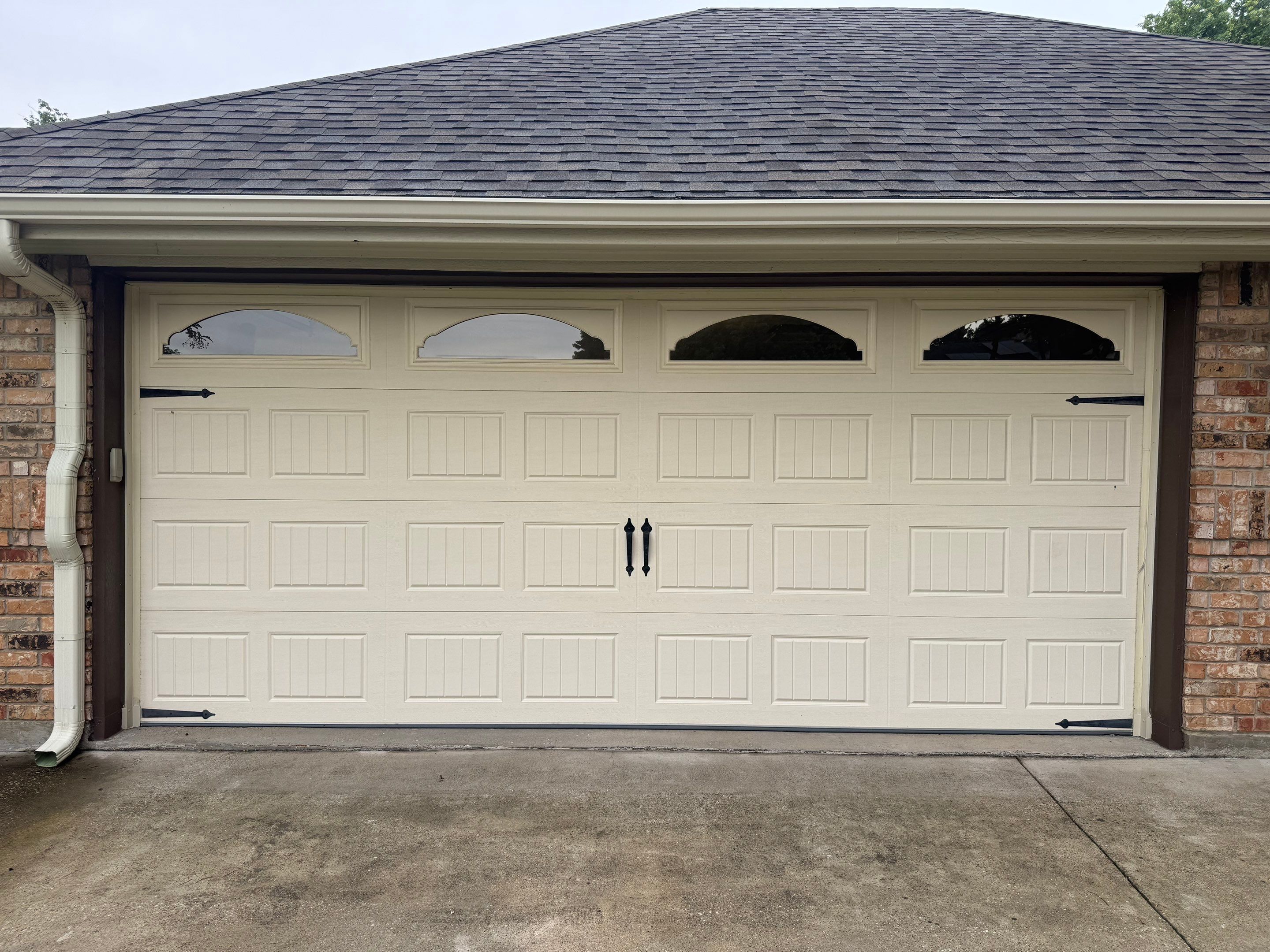 Custom Stained Cedar Garage Door Installation in Grapevine by Meadows Garage Doors