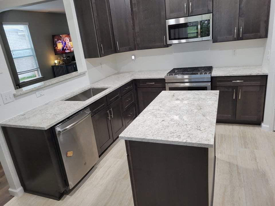 Kitchen countertops using Salinas White Granite  by Mena stone surfaces