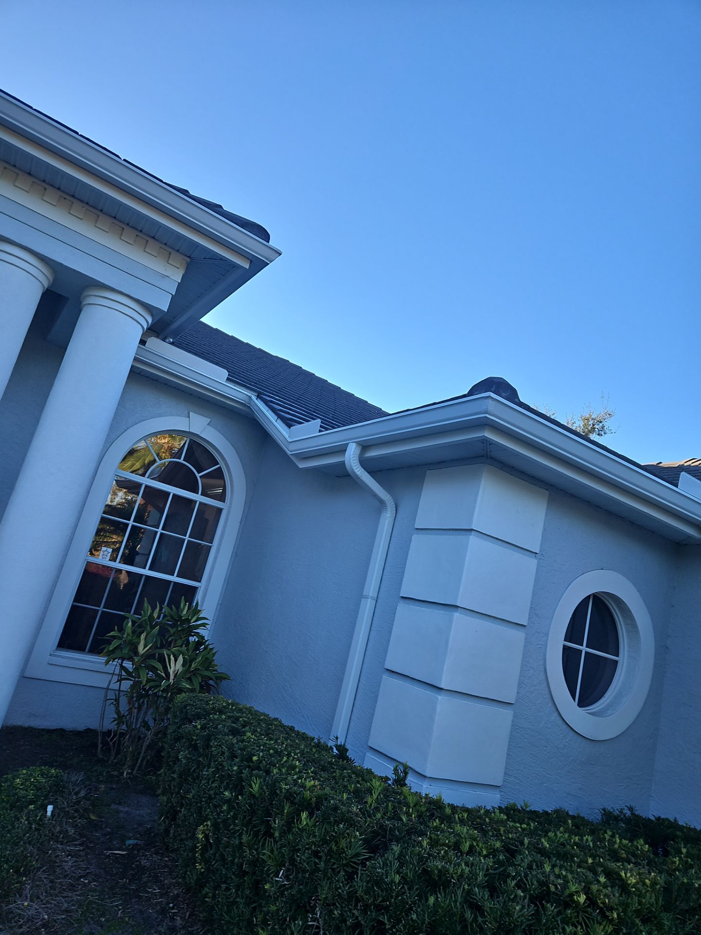 White Down Spouts using downspouts and White Seamless Gutters in Sarasota FL by Gutter Professors