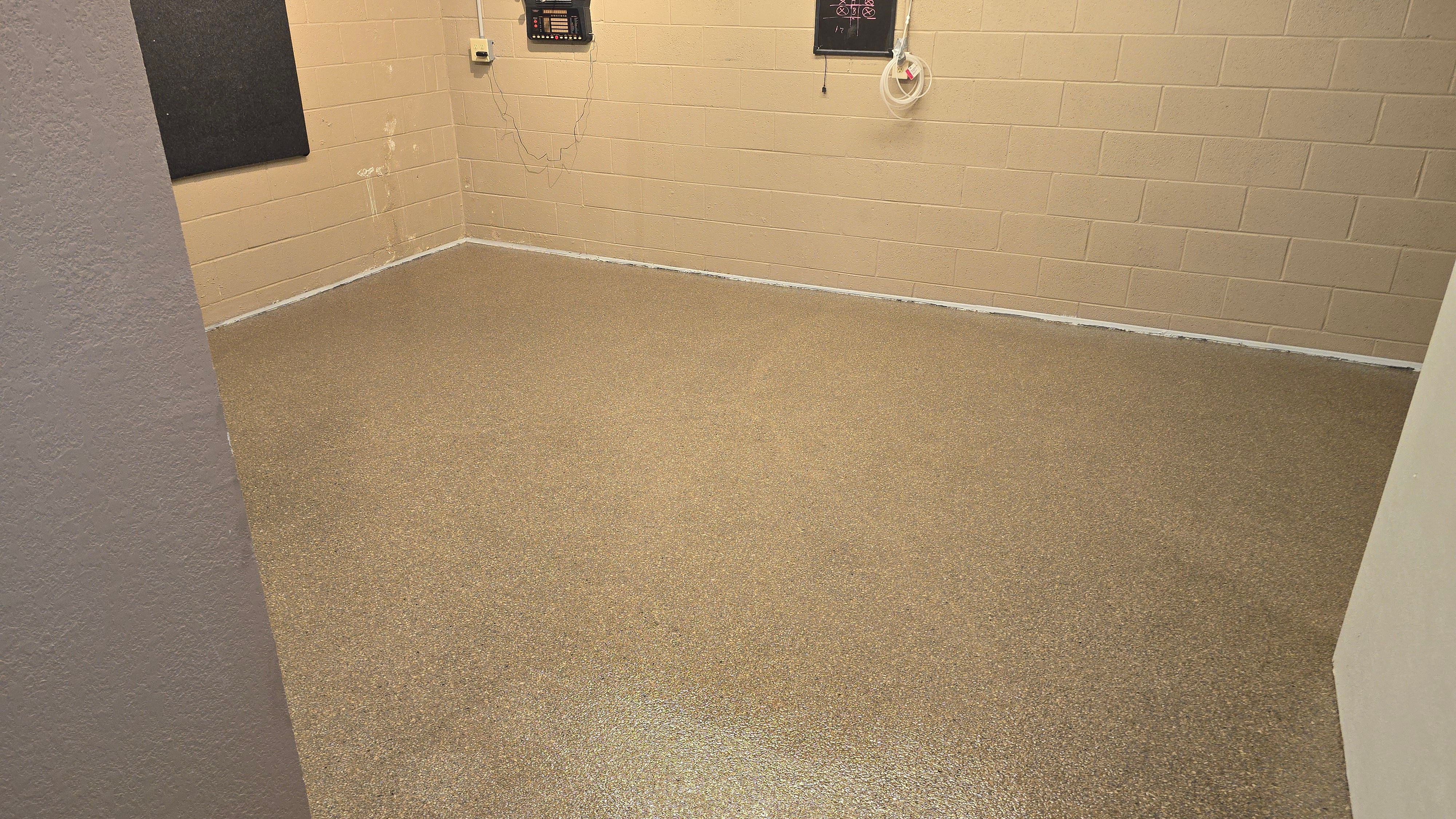 Garages, Basement & Patio Using Wombat & Obsidian by Elite Floor Solutions