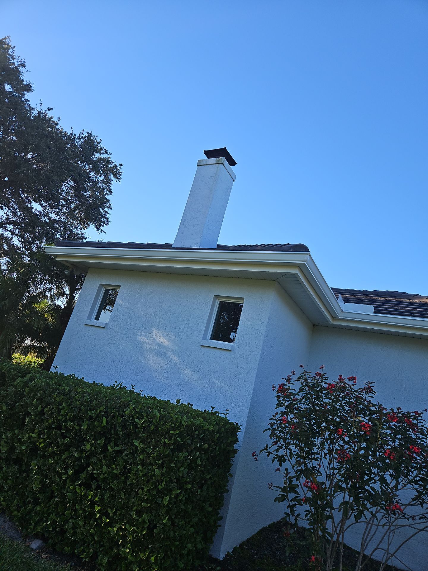 White Down Spouts using downspouts and White Seamless Gutters in Sarasota FL by Gutter Professors