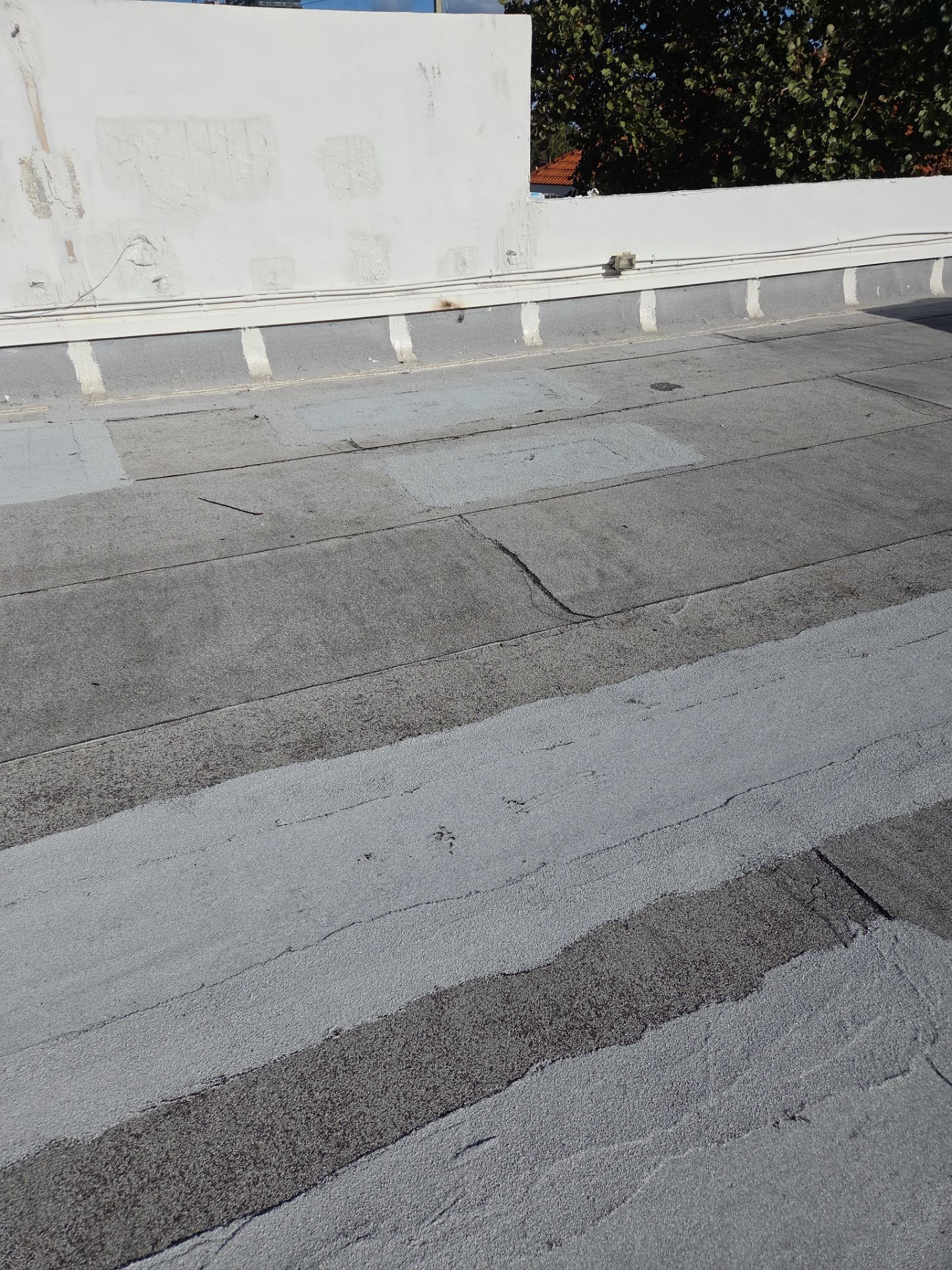 Commercial Flat Roof Restoration Using Silicone Coating in Hallandale Beach by Aastro Roofing