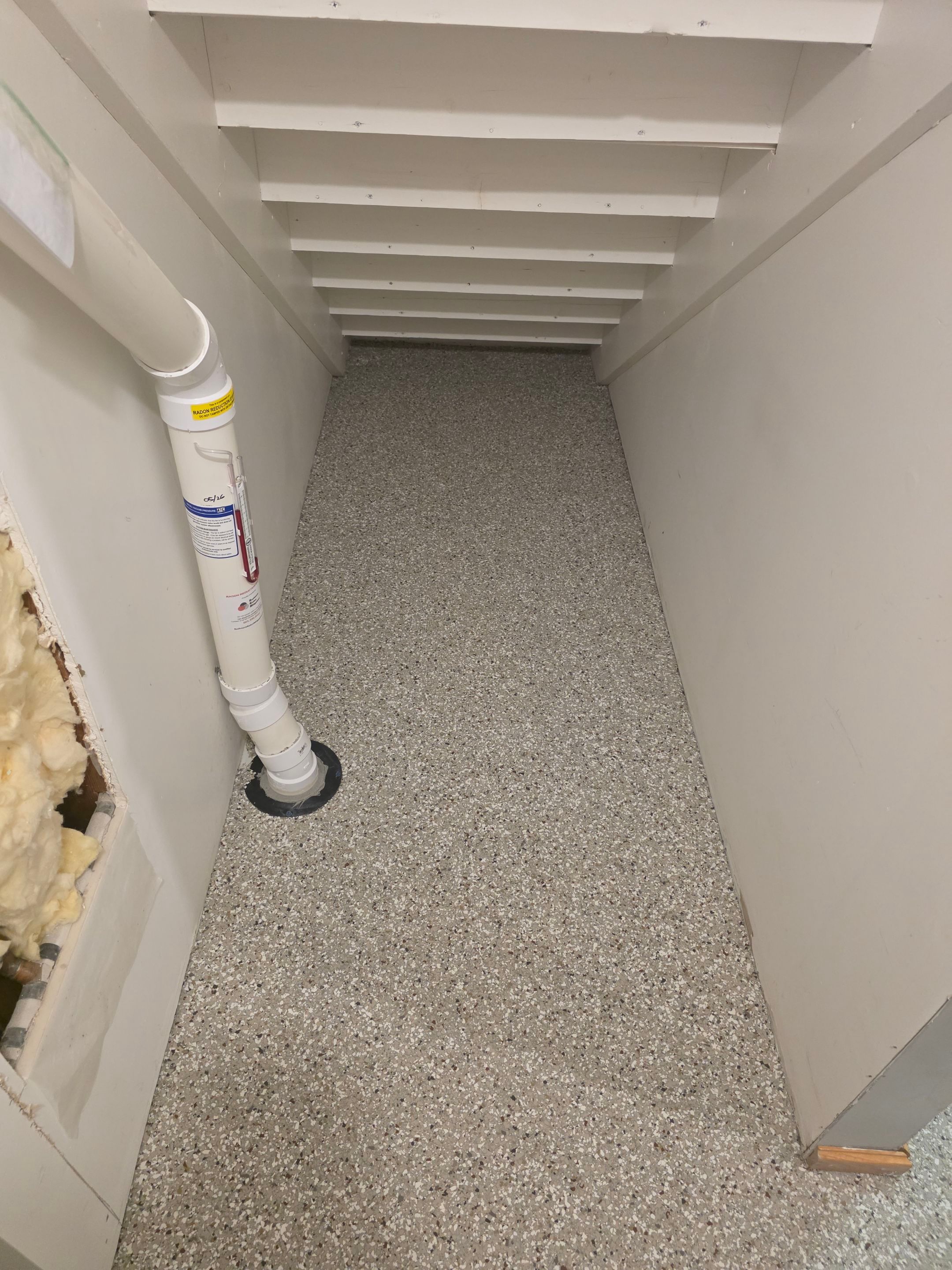 Full Garage and Basement Epoxy Floor Coating in Winner by Select Painting, Coatings & Garage Cabinets
