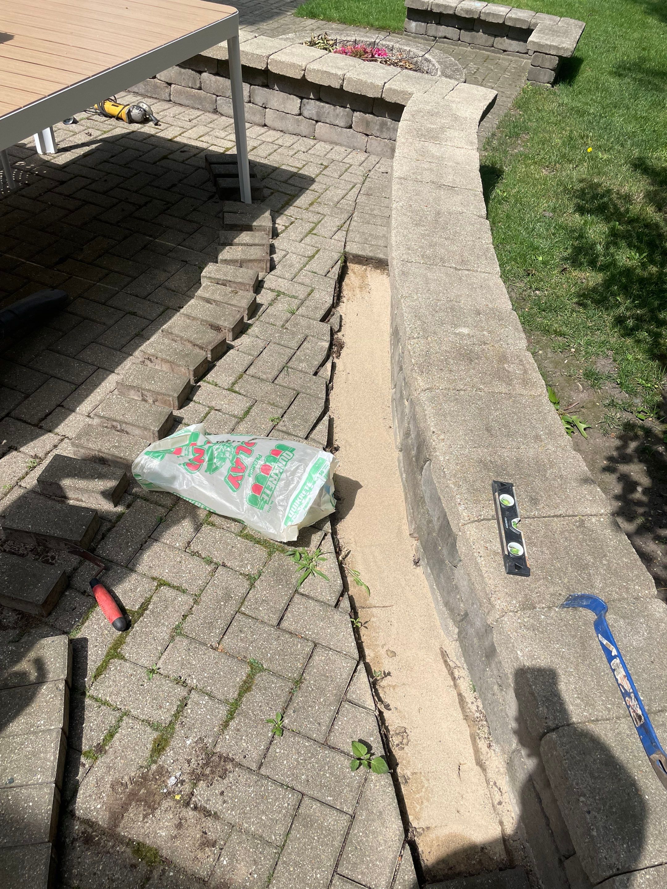 Brick patio repair, clean sand and seal by Northern Power Washing LLC.