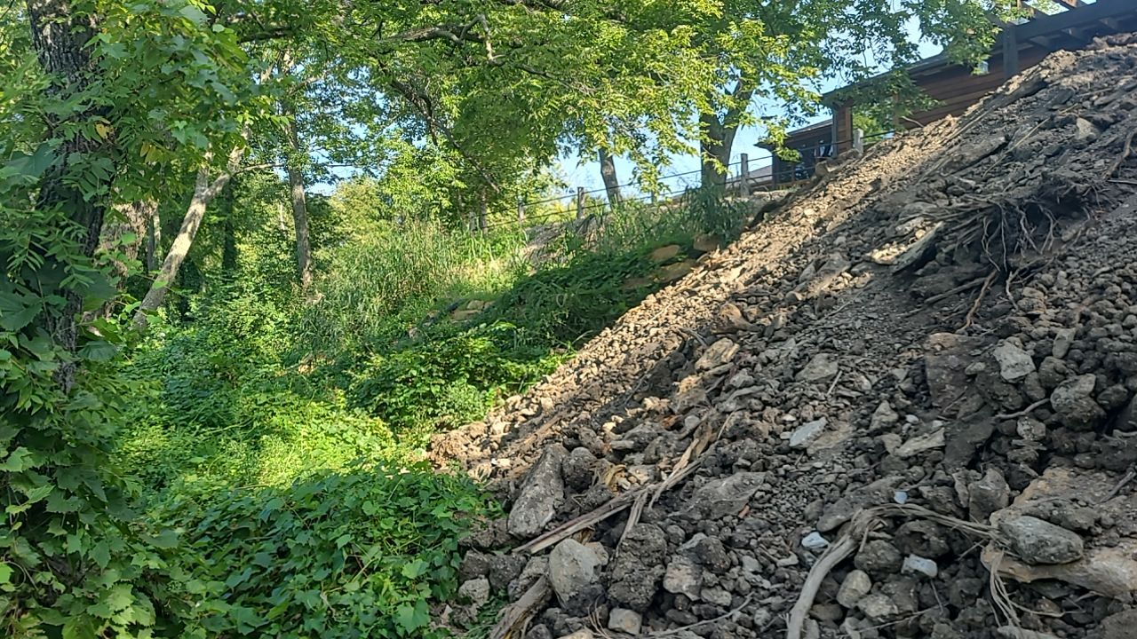 Supporting back of home with backfill at edge of steep creek by LAND ESCAPES LLC