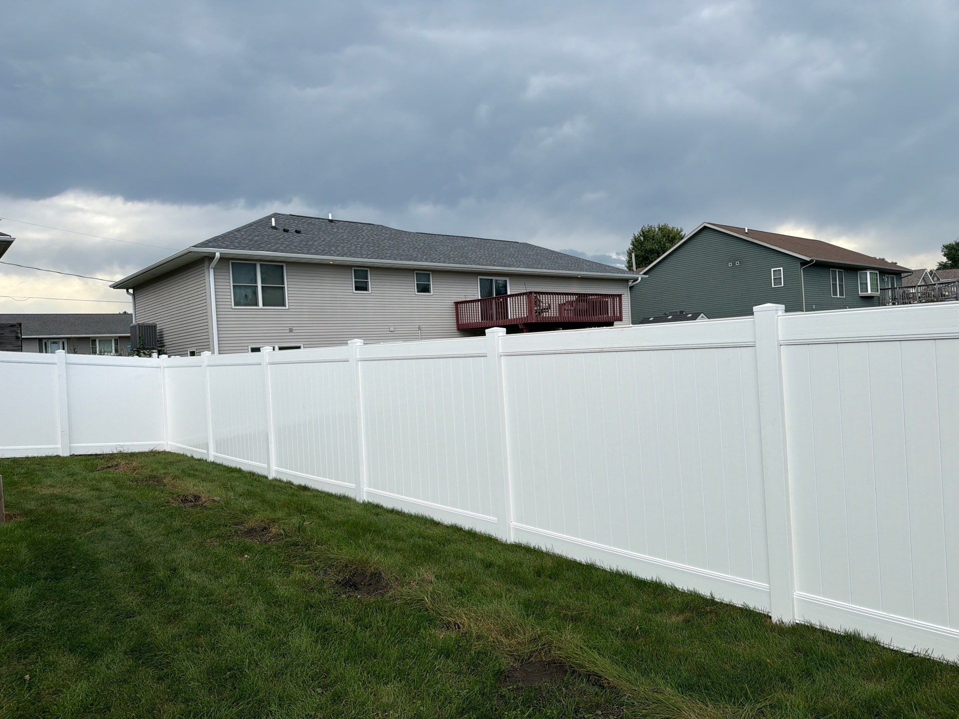 White Vinyl Privacy Fence Installation in Raymond, IA by Perfect Picket Fence and Stain