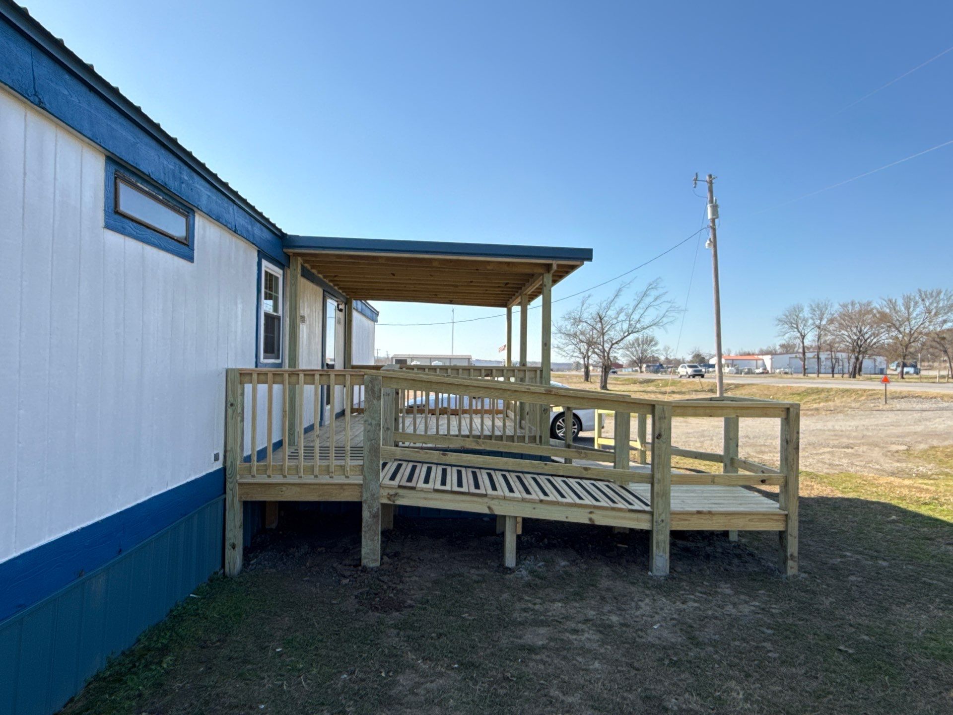 Covered Deck w/ ADA Ramp by In & Out Construction & Remodeling, LLC