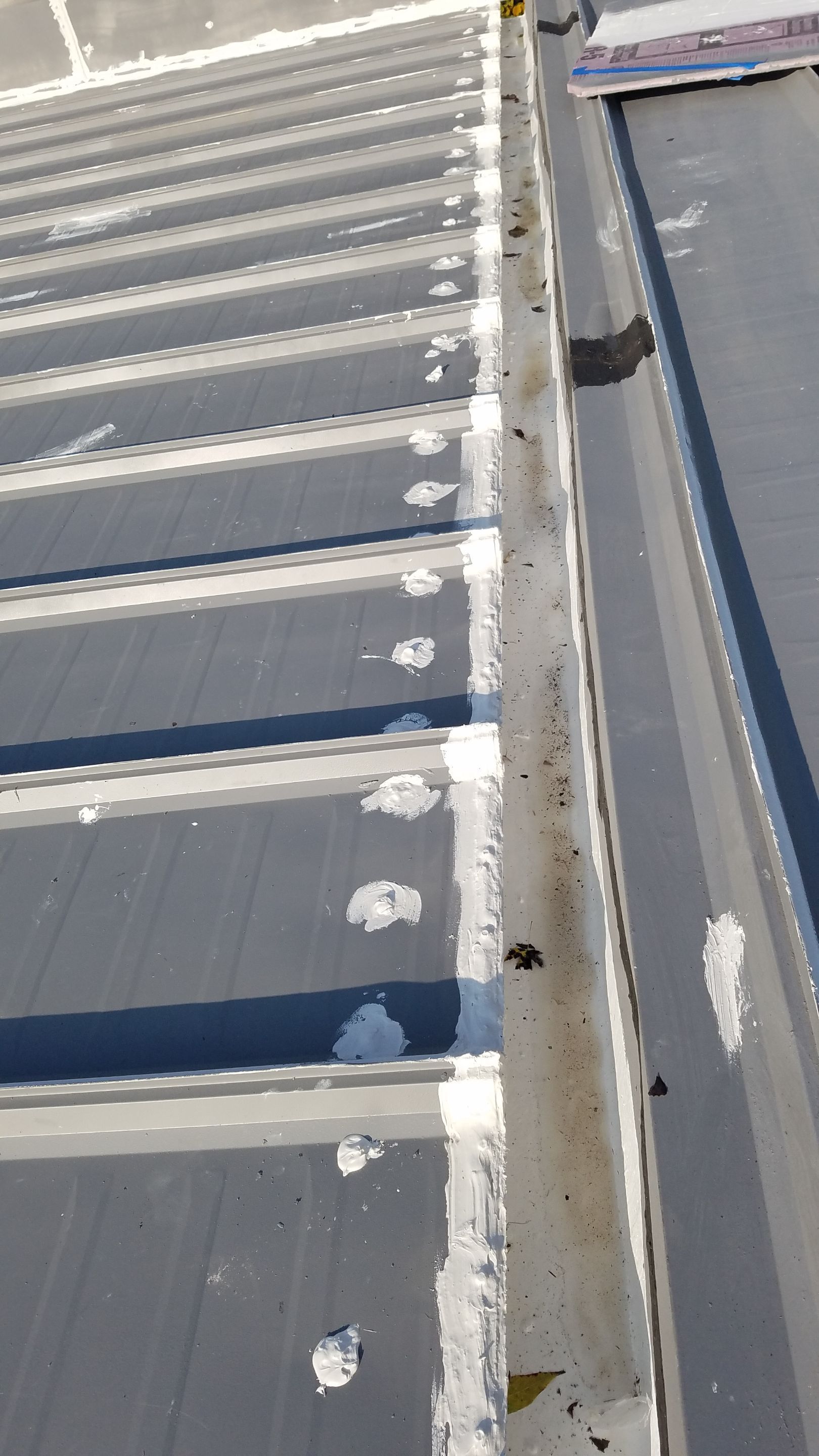 Commercial Metal Roof Coating by Gold Star Roofing LLC
