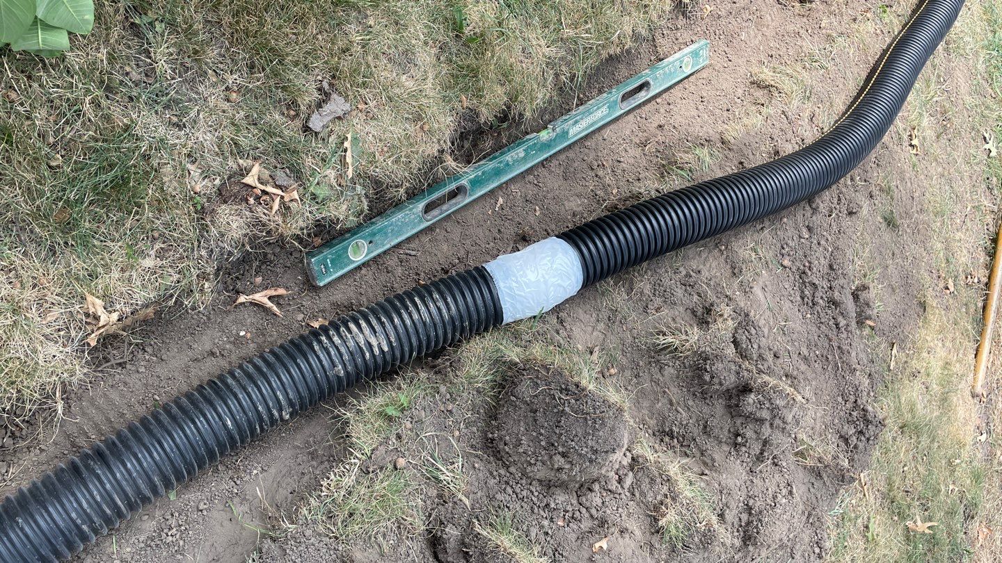 Drain Tile, Window Wells & Buried Discharge in Minneapolis by Waterproofing Northeast